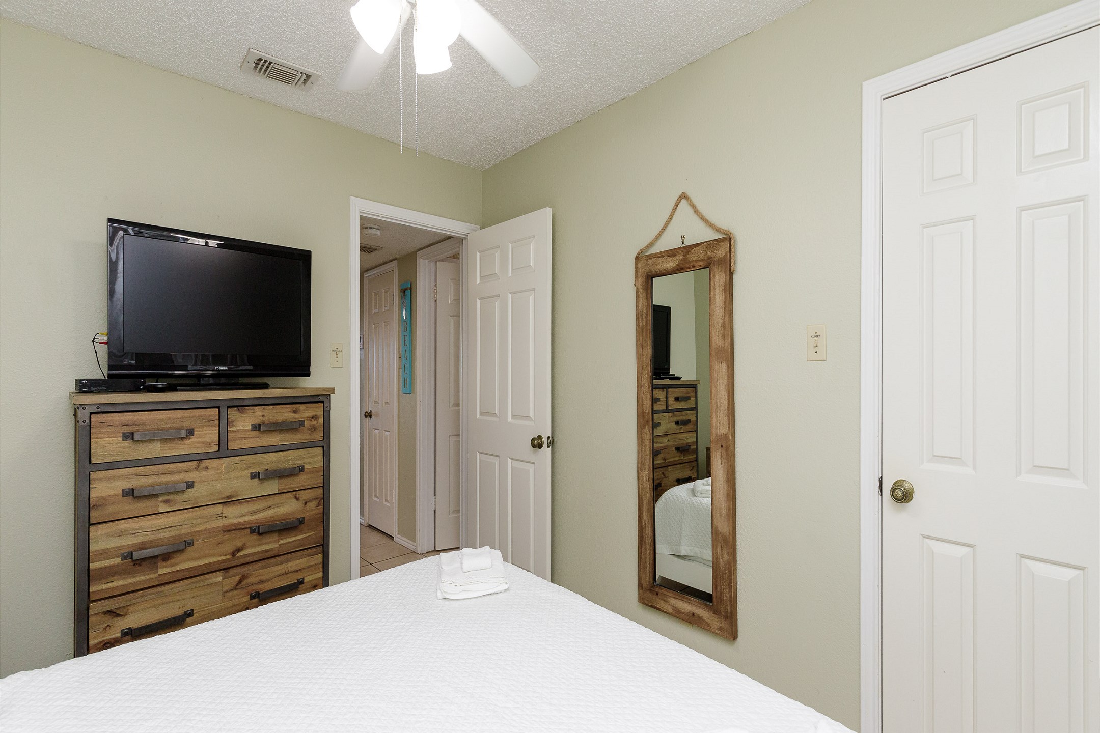Master bedroom with king size bed and flat screen TV
