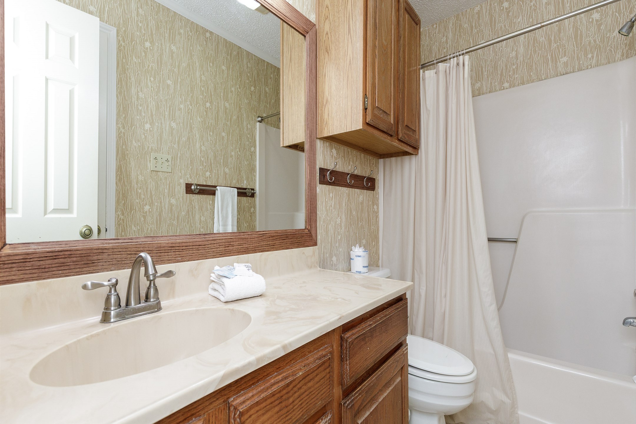 Guest bathroom with tub and shower combo