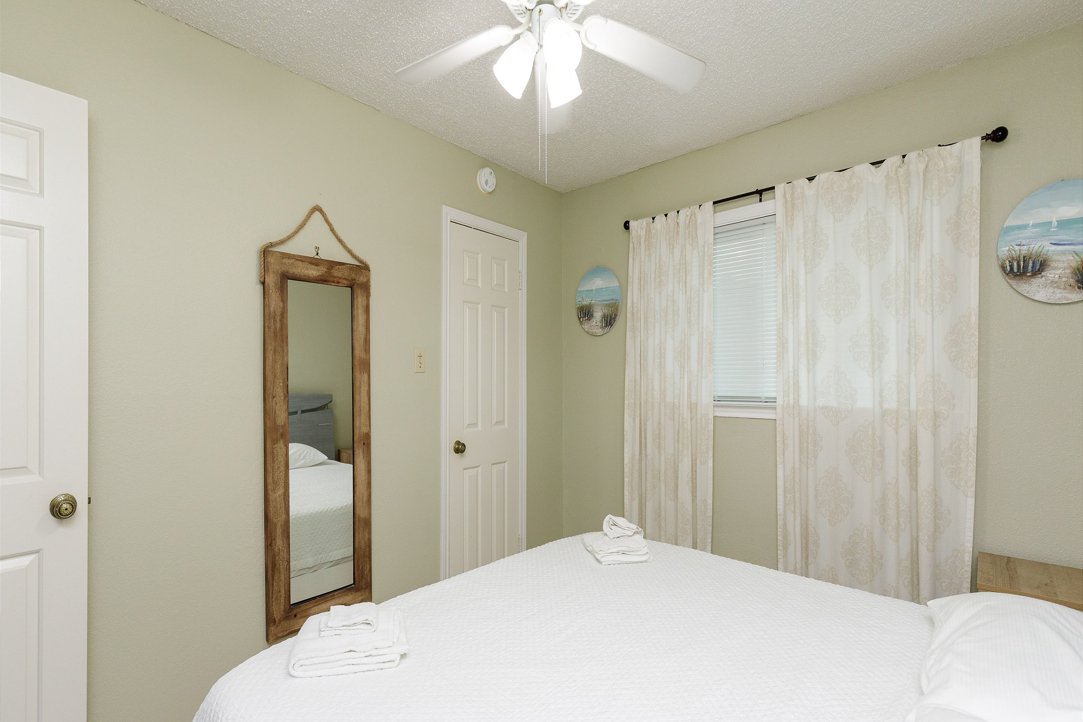 Master bedroom with king size bed and flat screen TV