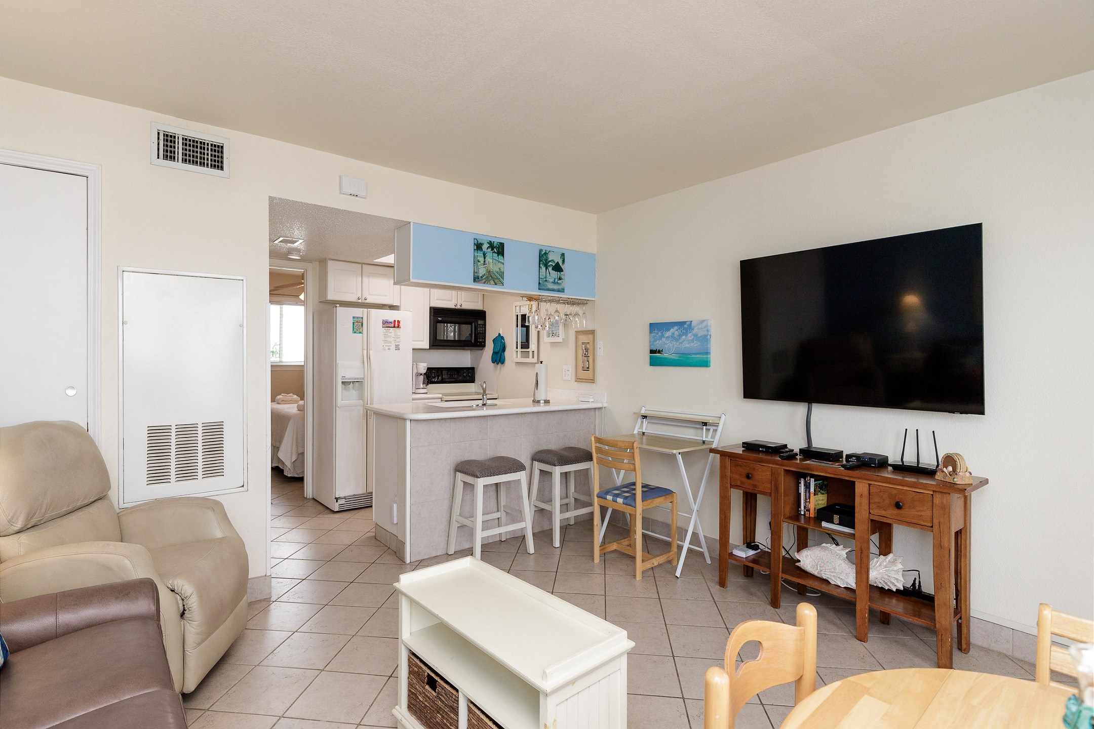 Open concept living and kitchen area including work space 