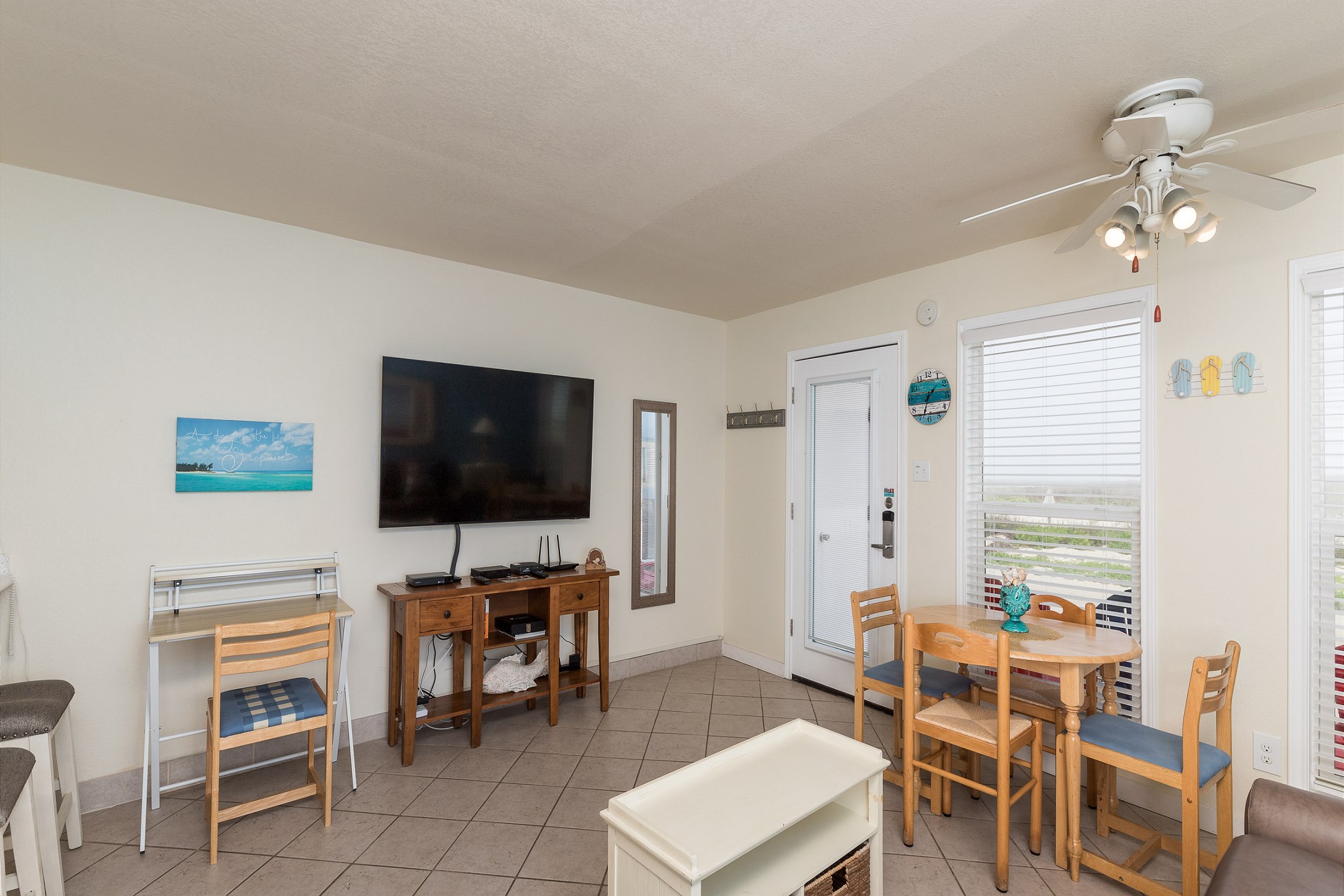 Entertainment center with flat-screen TV and plenty of seating