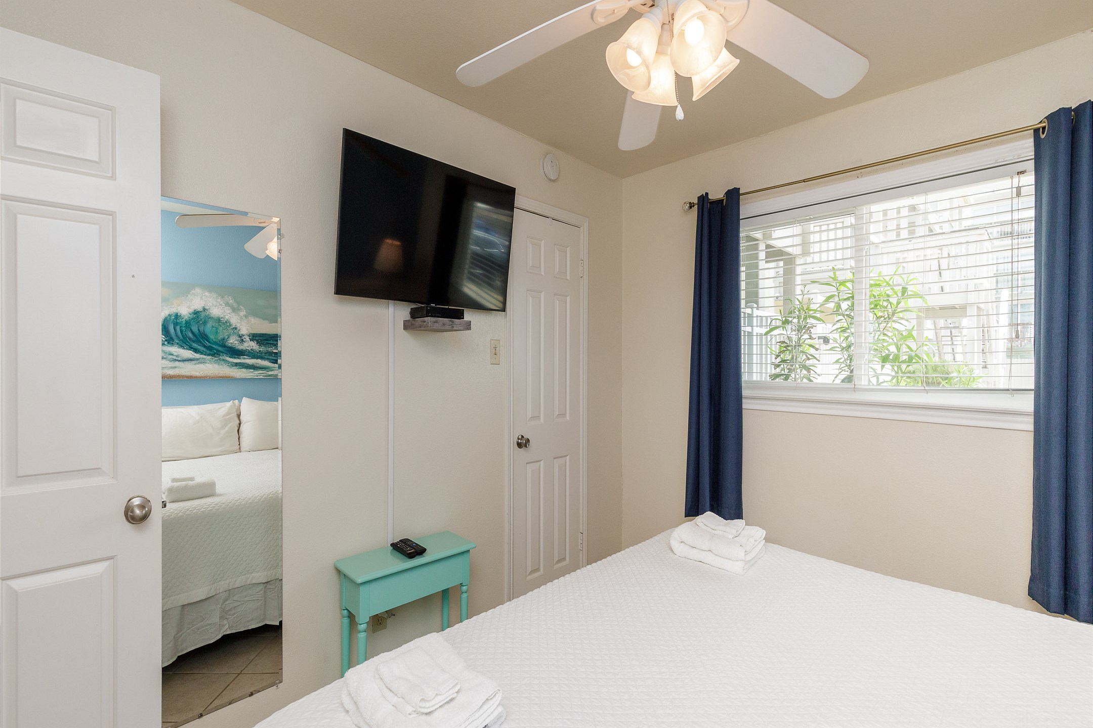 Master bedroom with king size bed and flat screen TV