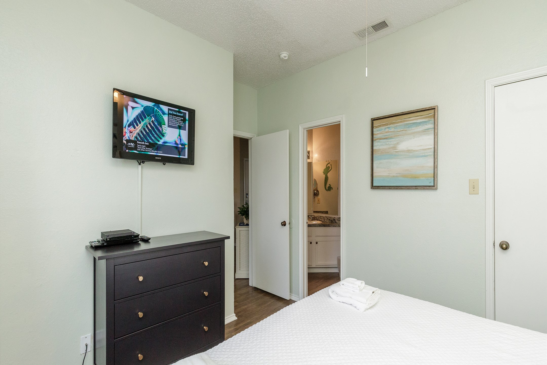 Master bedroom with king size bed and flat screen TV