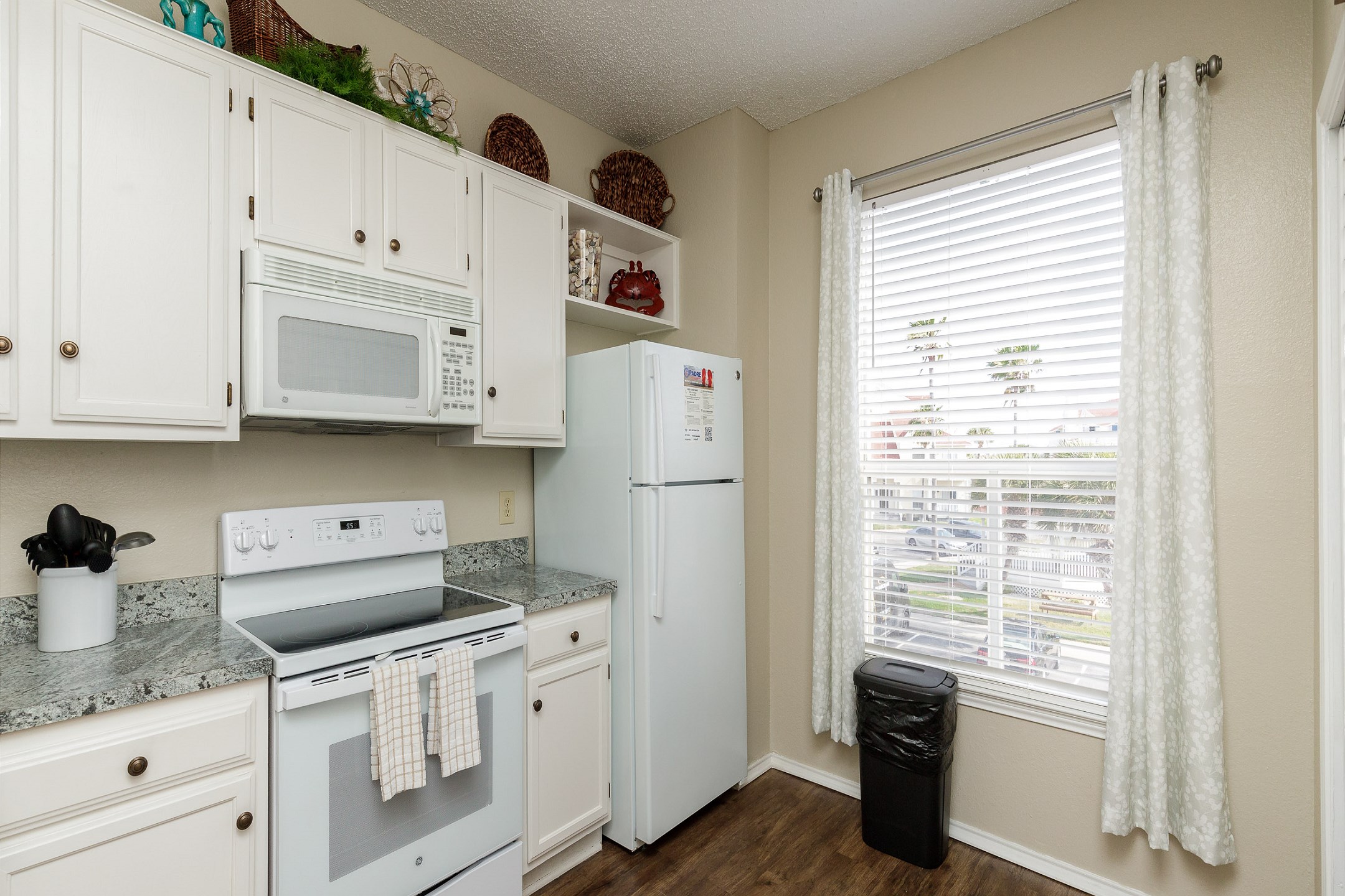 Fully equipped kitchen with ample storage and counter space 