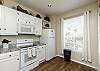 Fully equipped kitchen with ample storage and counter space 