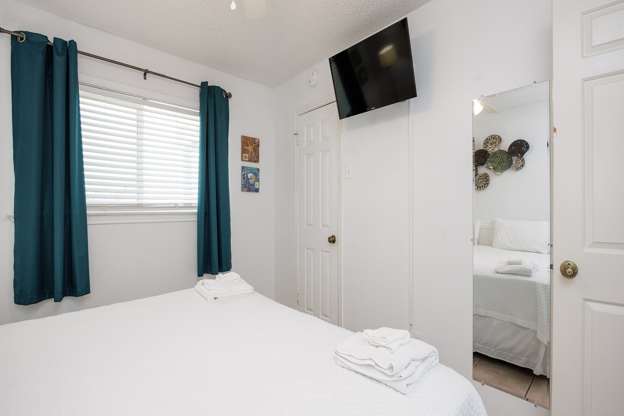 Master bedroom with king size bed and flat screen TV