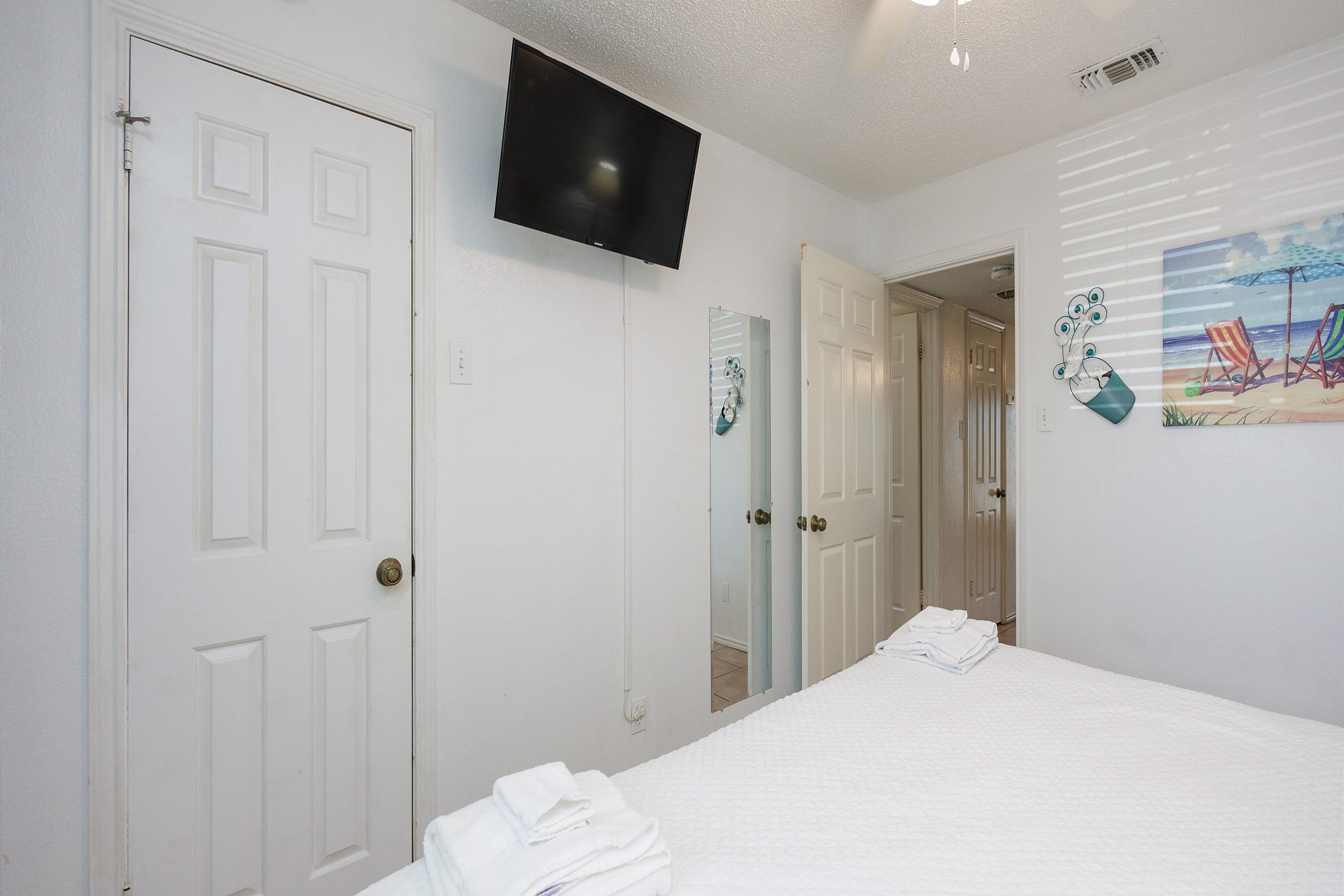 Master bedroom with king size bed and flat screen TV