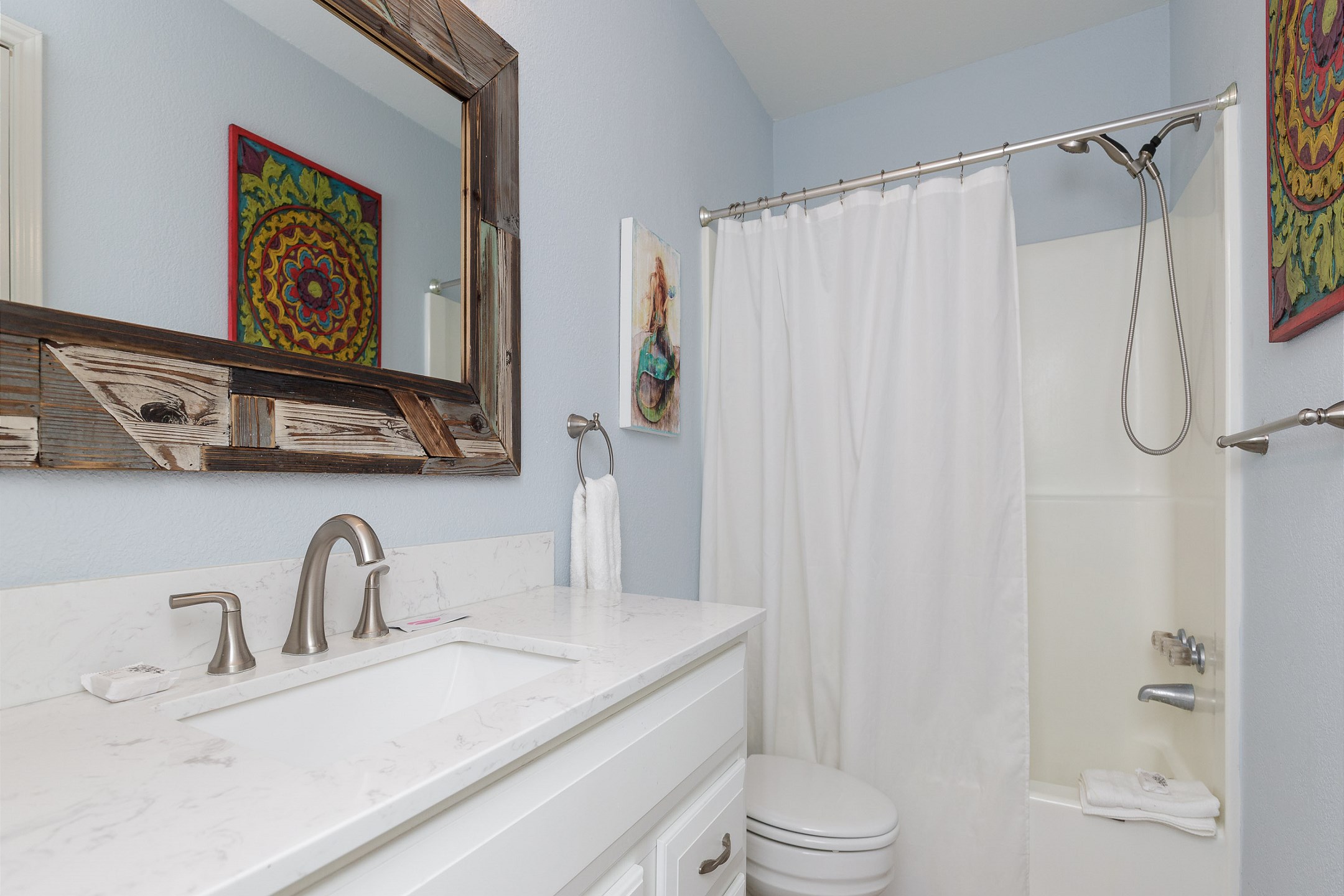 Guest bathroom with tub and shower combo