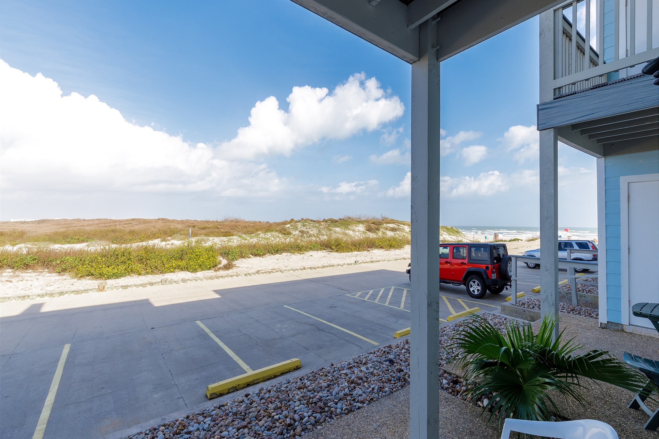 Partial view of beach from private patio 