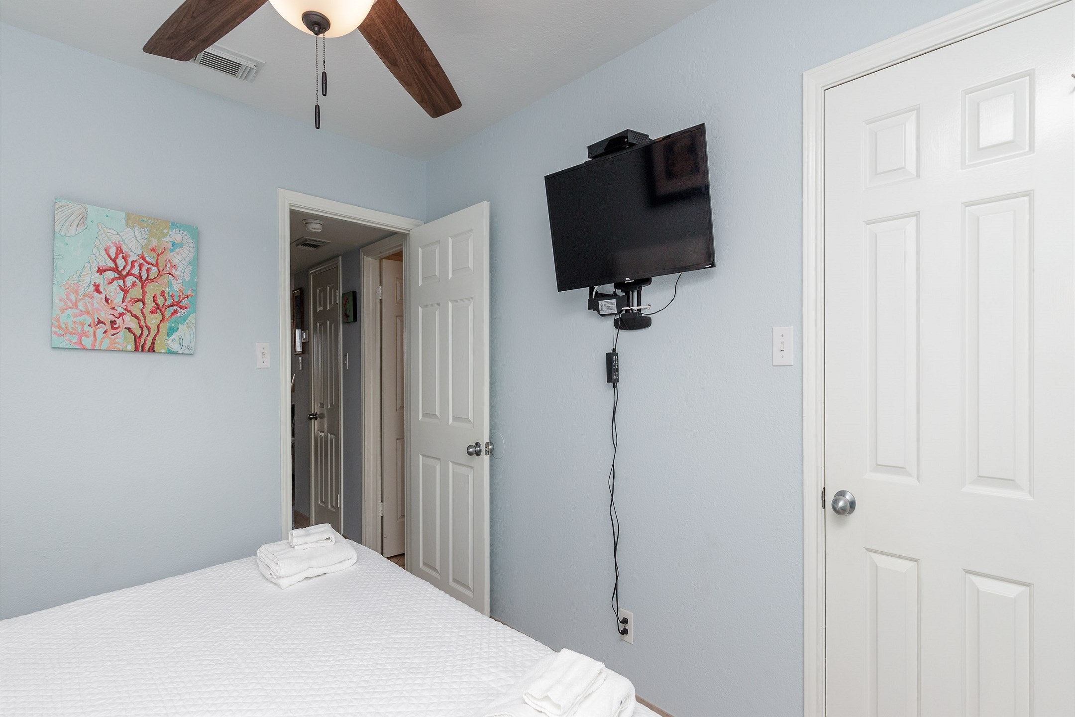 Master bedroom with king size bed and flat screen TV