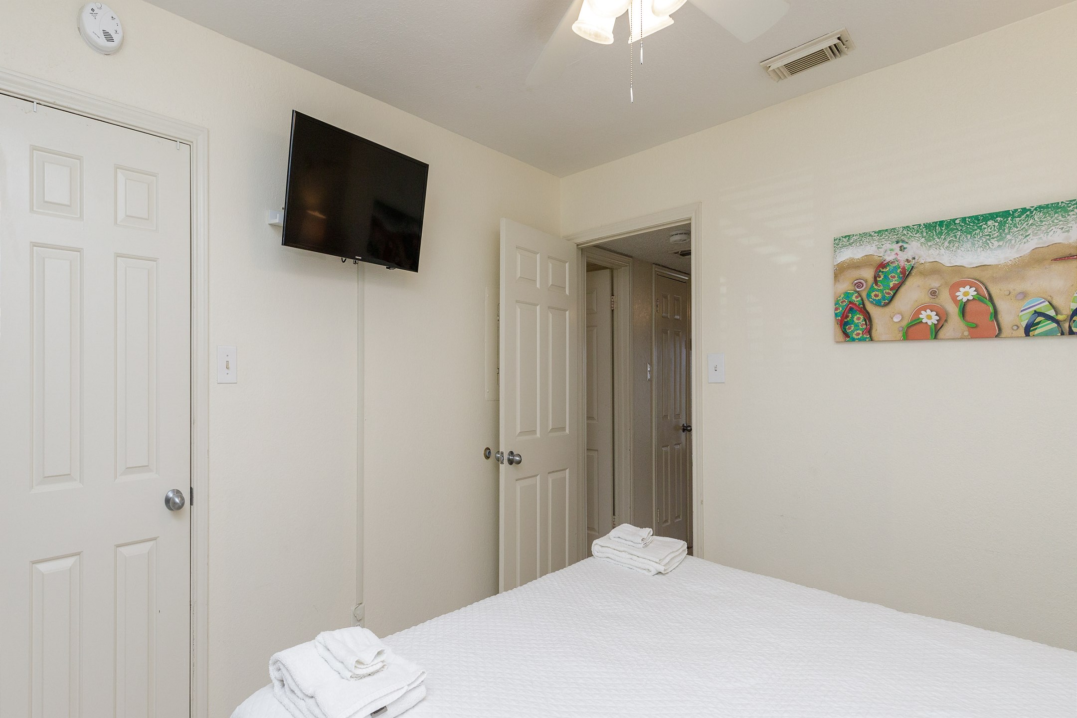 Master bedroom with king size bed and flat screen TV