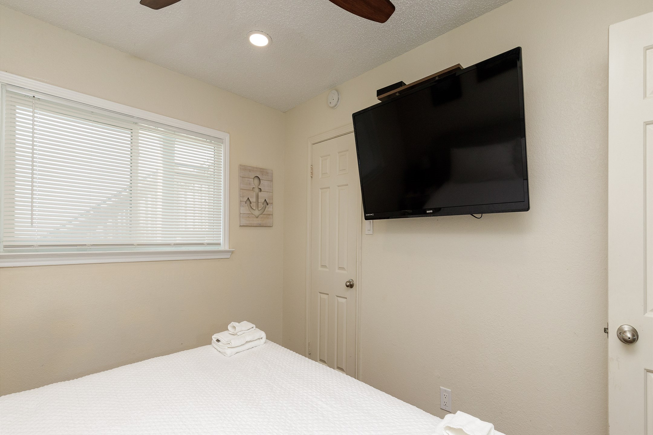 Master bedroom with king size bed and flat screen TV