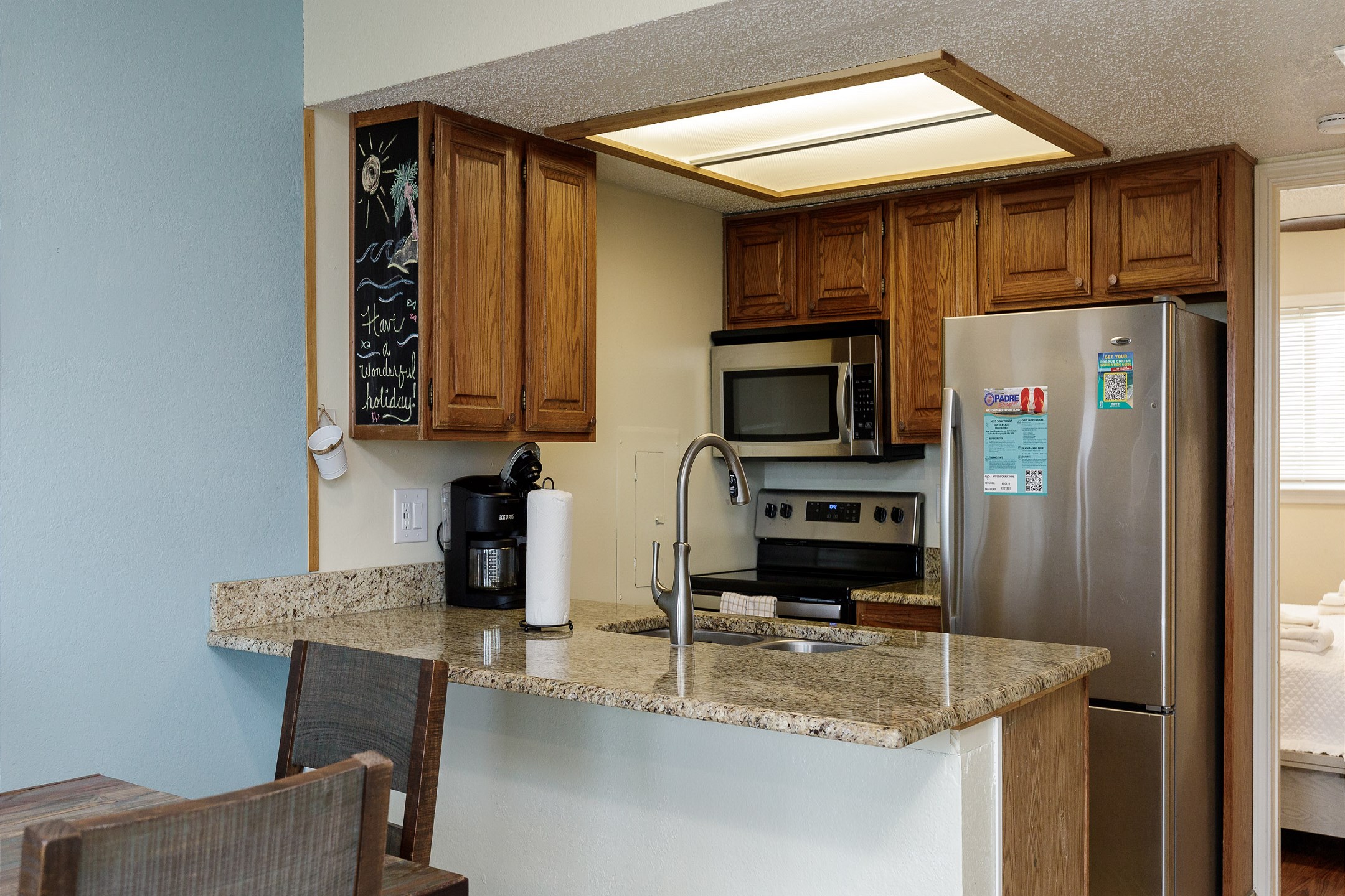 Open kitchen area with coffee maker, toaster, and other essentials provided