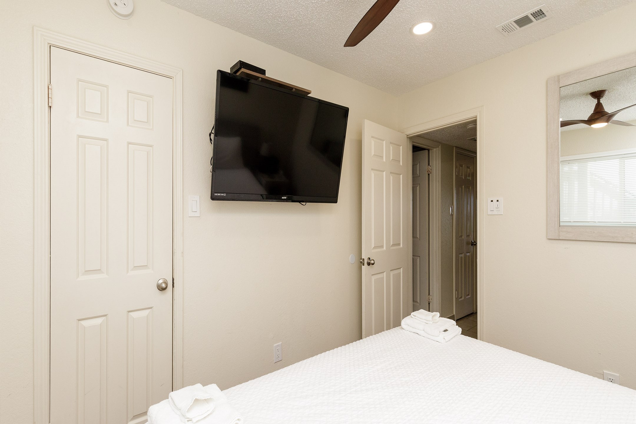 Master bedroom with king size bed and flat screen TV