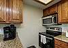 Fully equipped kitchen with stainless steel appliances along with a Keurig and 12 cup coffee maker 