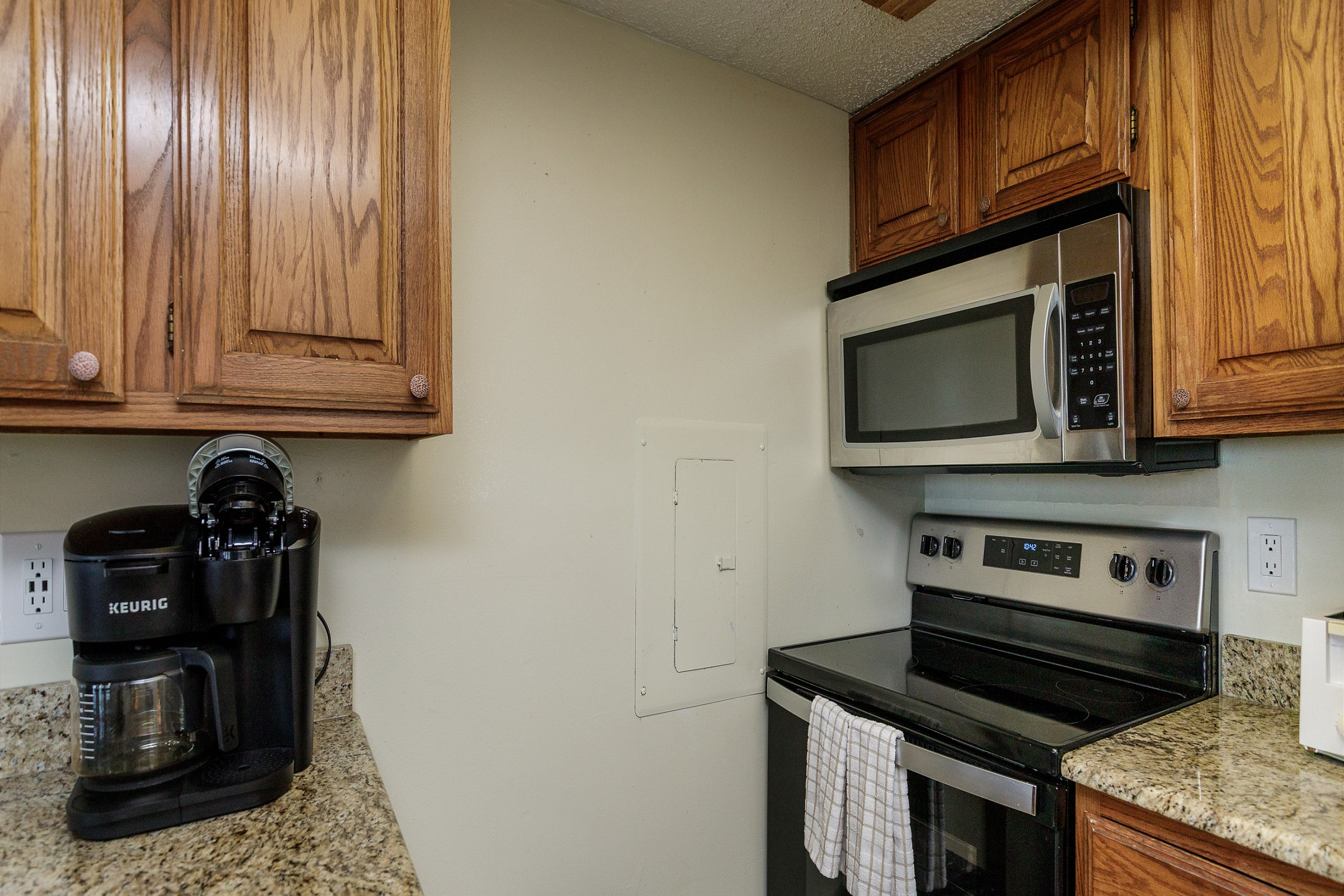 Well equipped kitchen with stainless steel appliances along with a Keurig and 12 cup coffee maker 