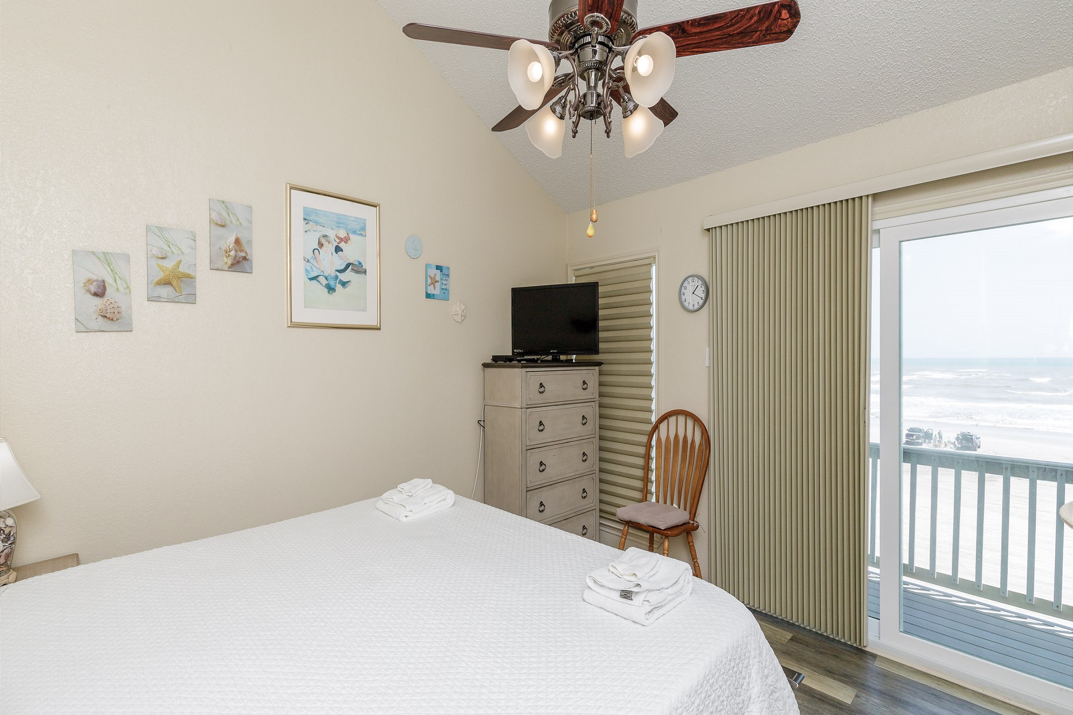 Master bedroom on the second floor with king size bed, ensuite bathroom, private balcony with a beachfront view and flat screen TV