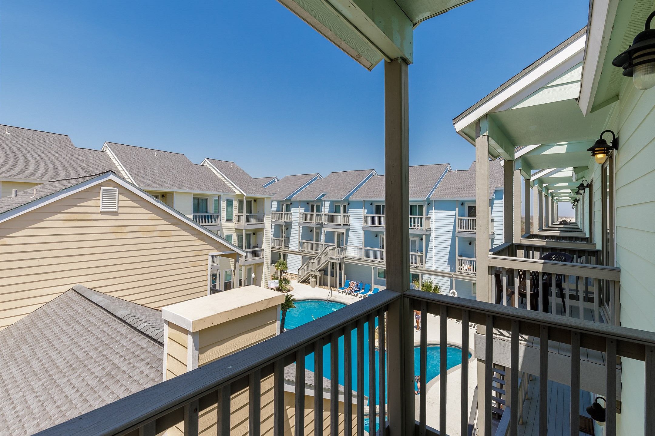 Private balcony off the second bedroom with beautiful pool views 