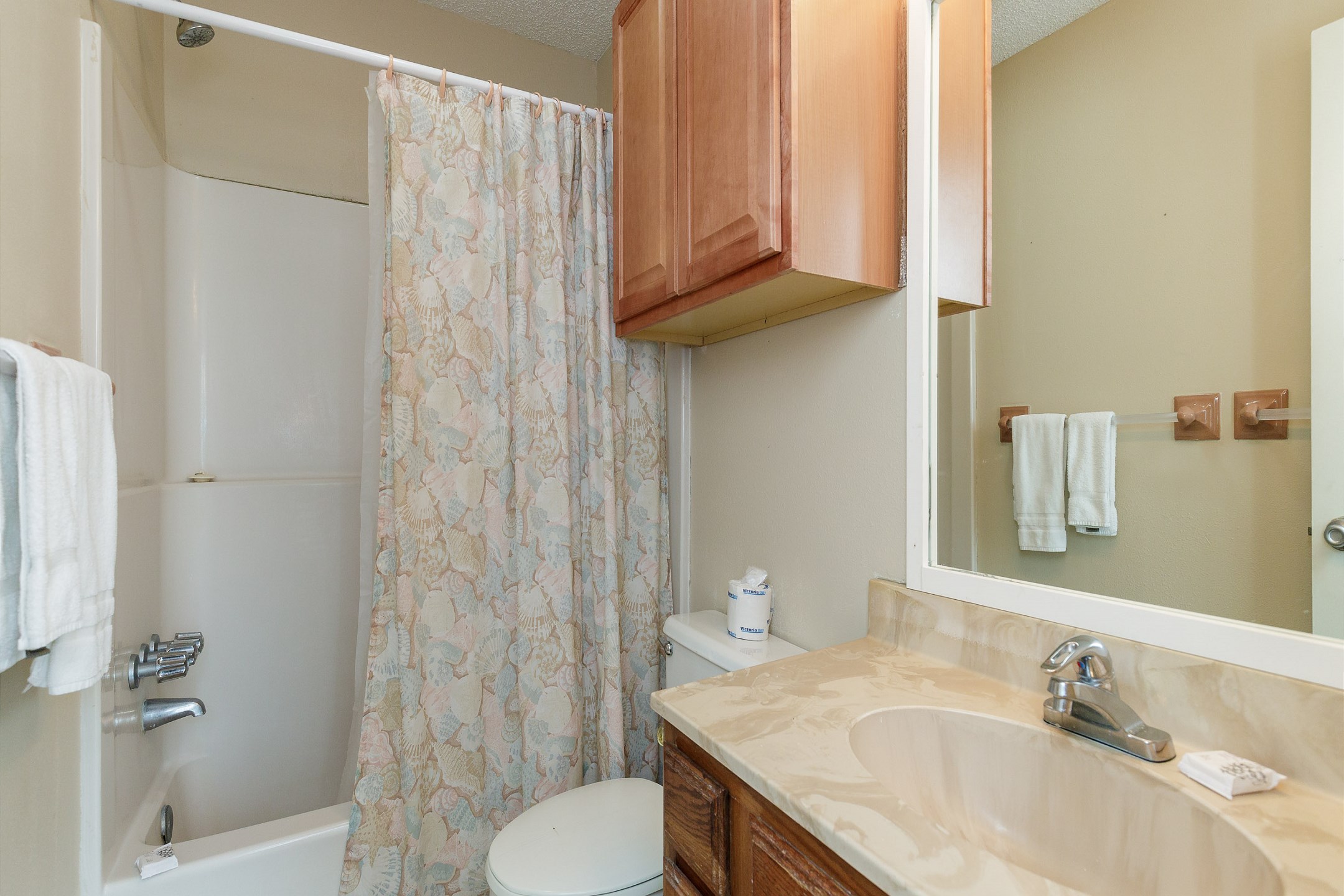 Guest bathroom on the second floor with tub and shower combo
