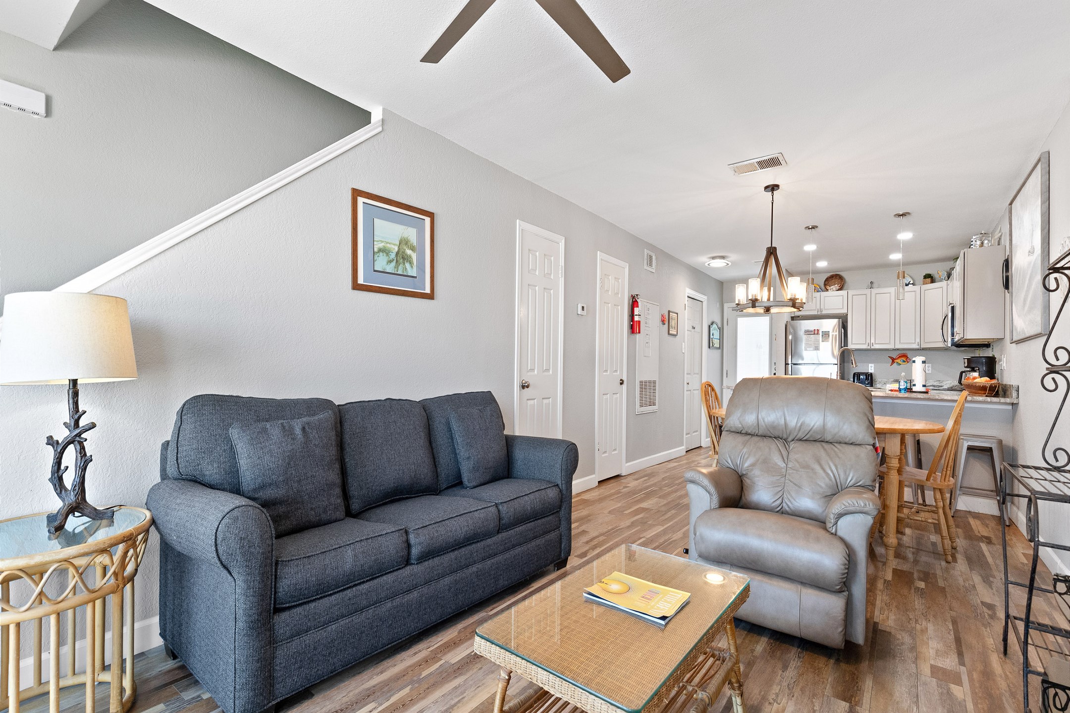 Living area with queen size sleeper sofa and recliner