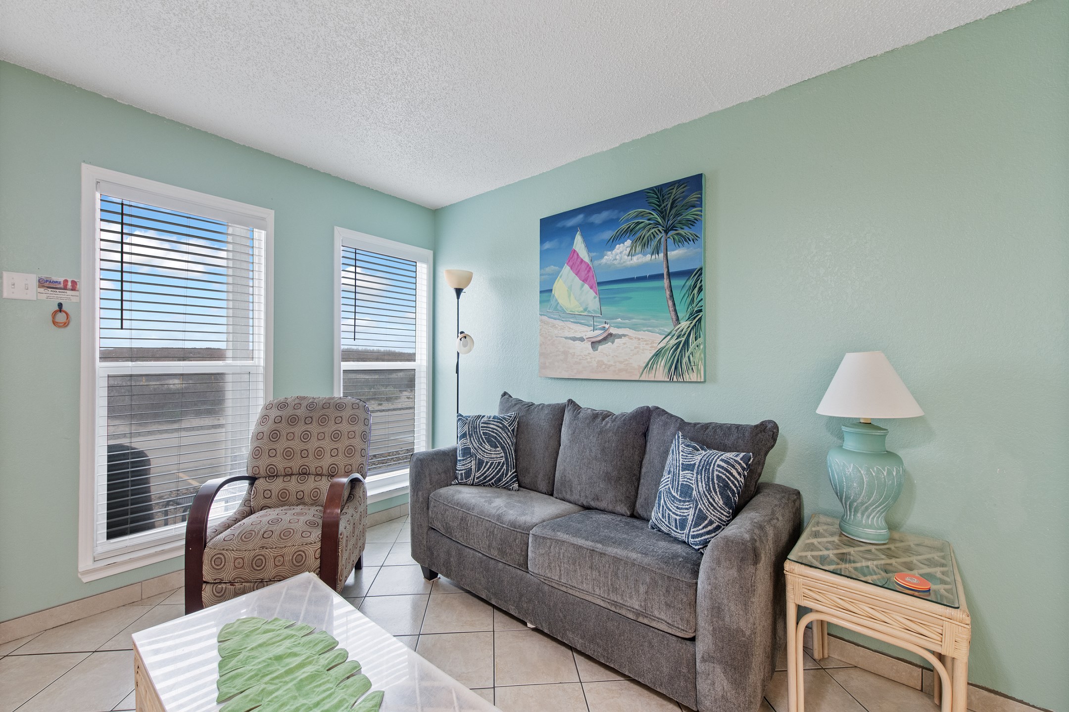 Cozy living space with new sofa - perfect for relaxing on your vacation with natural light shinning in