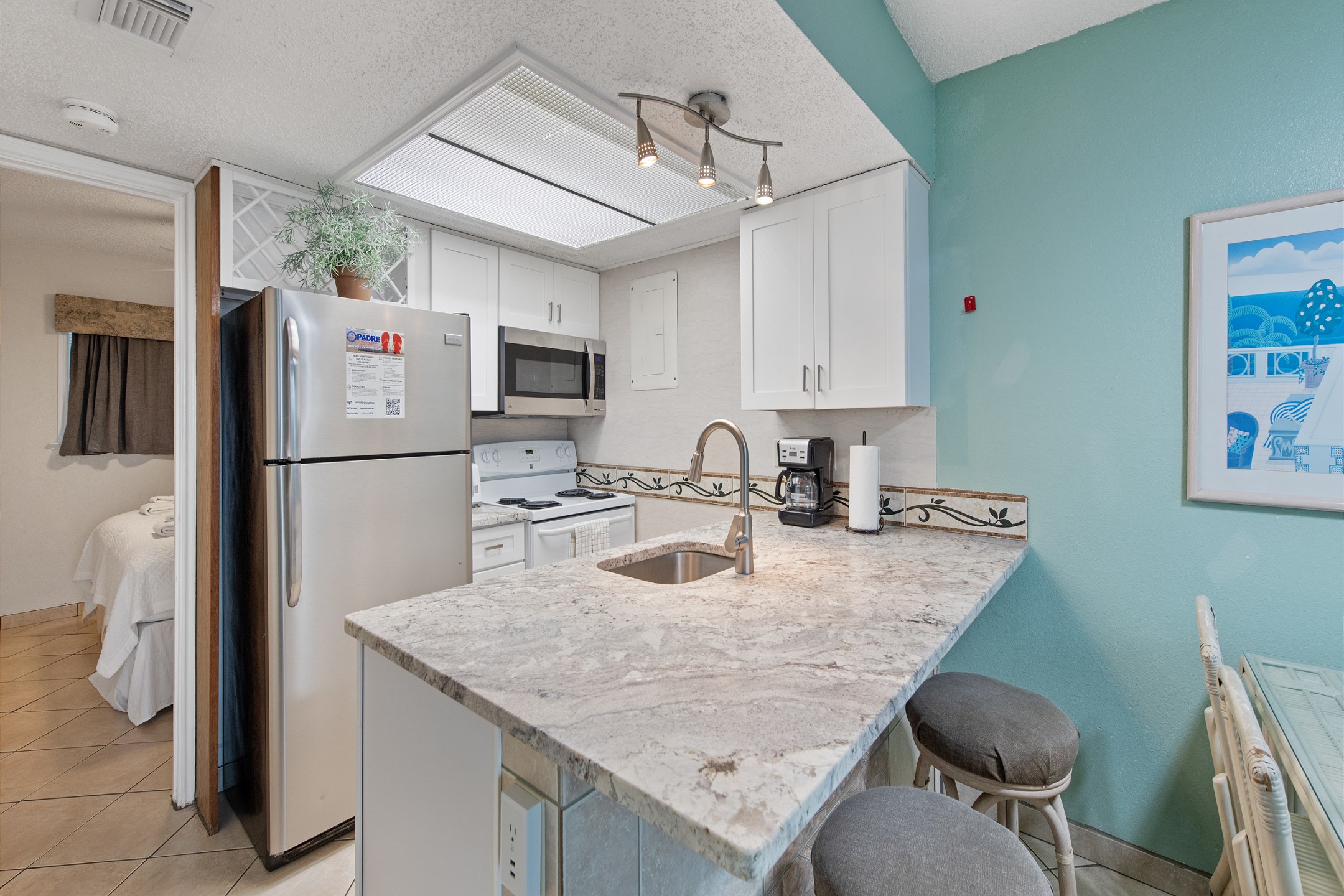 Newly updated, fully equipped kitchen with beautiful counter tops, coffee maker, toaster, and other essentials provided