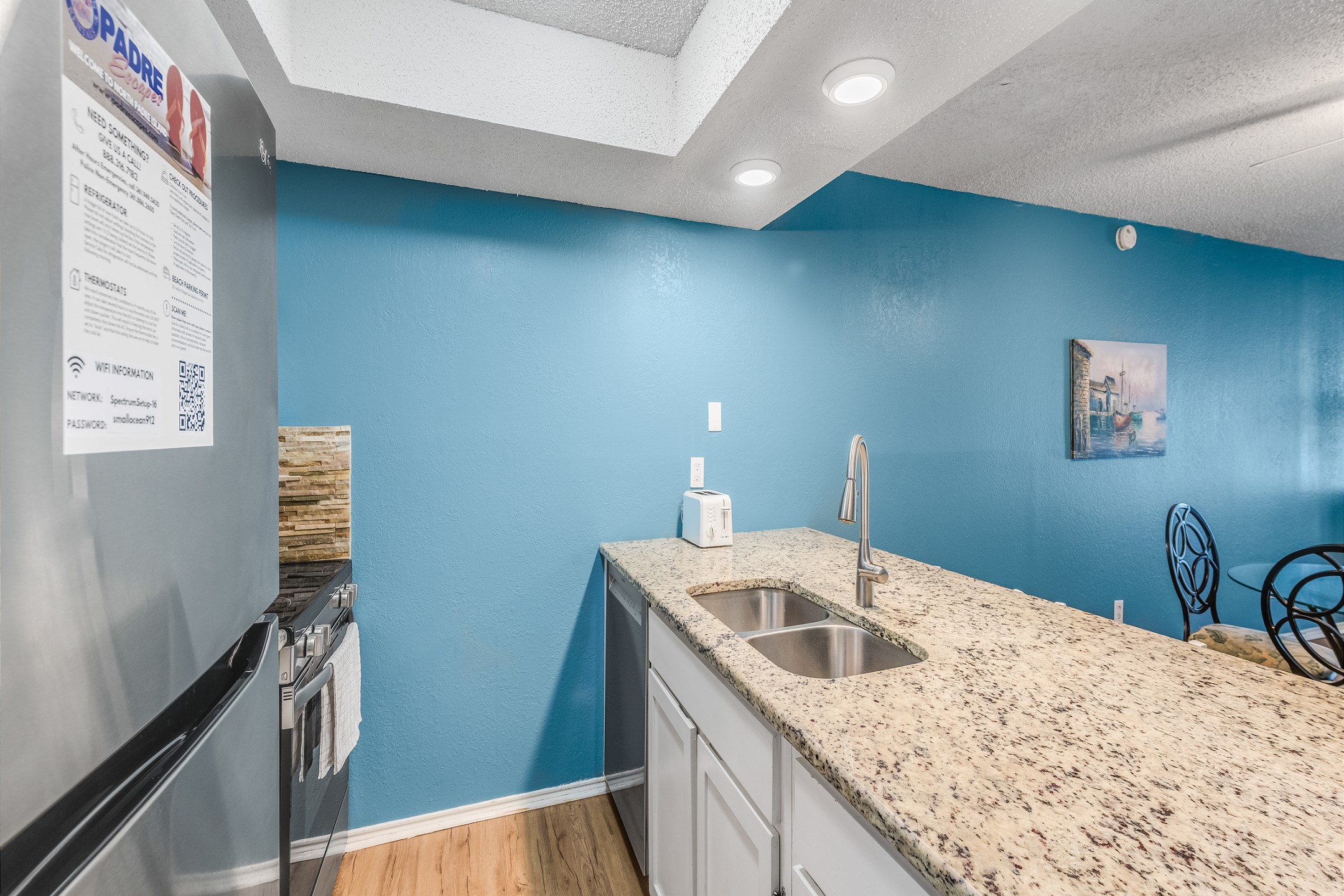 Lovely kitchen area with beautiful counter tops and plenty of storage space