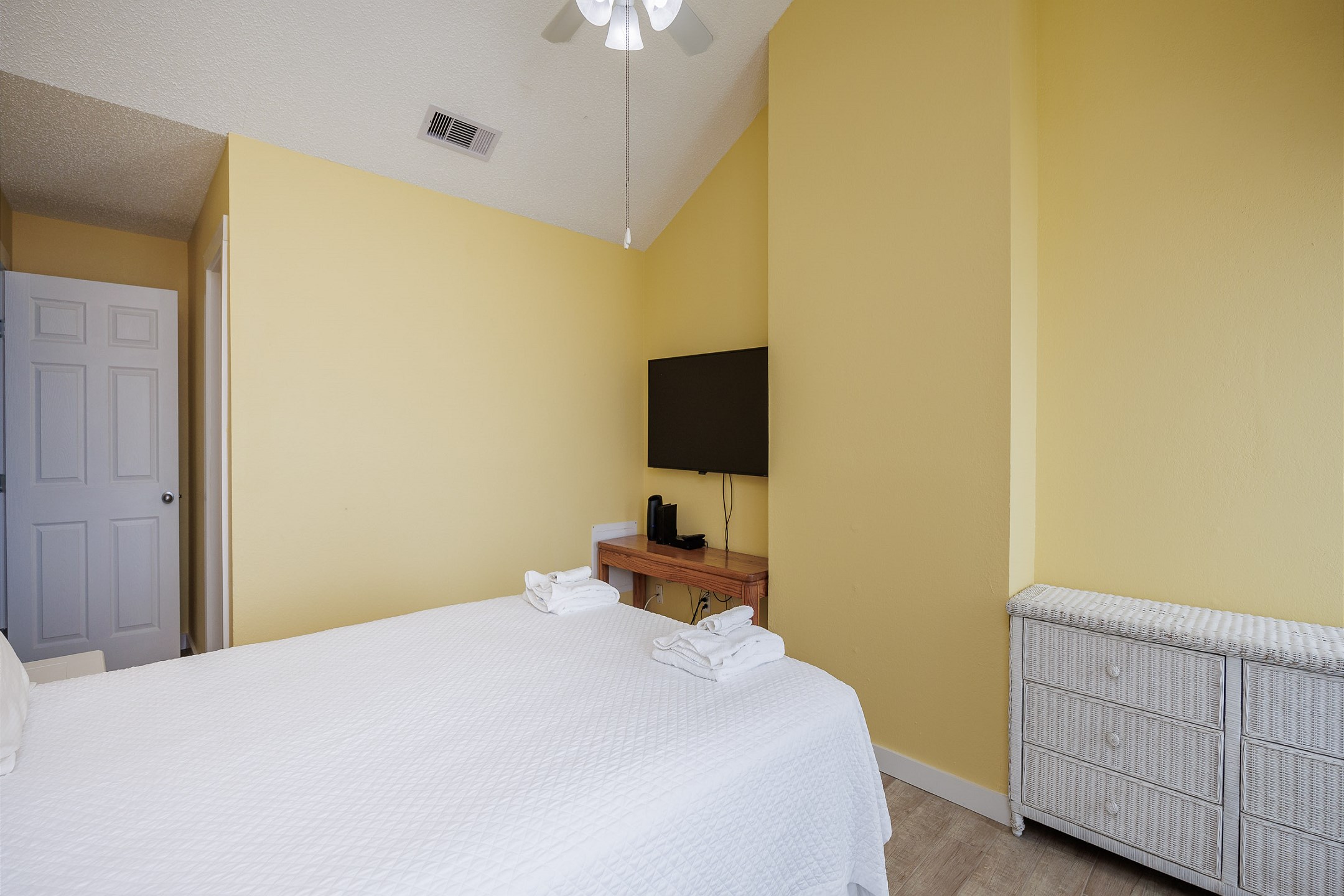 Master bedroom on the second floor with queen size bed, private bathroom, balcony and flat screen TV