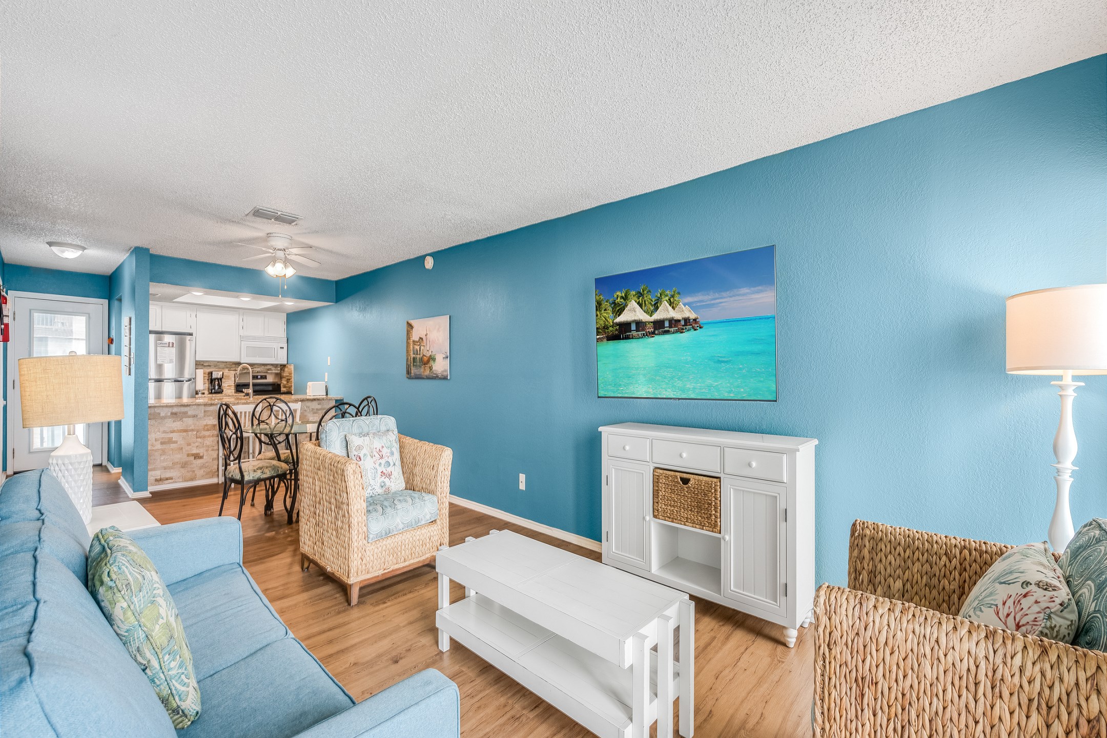 Open concept living, dining and kitchen area with new features throughout