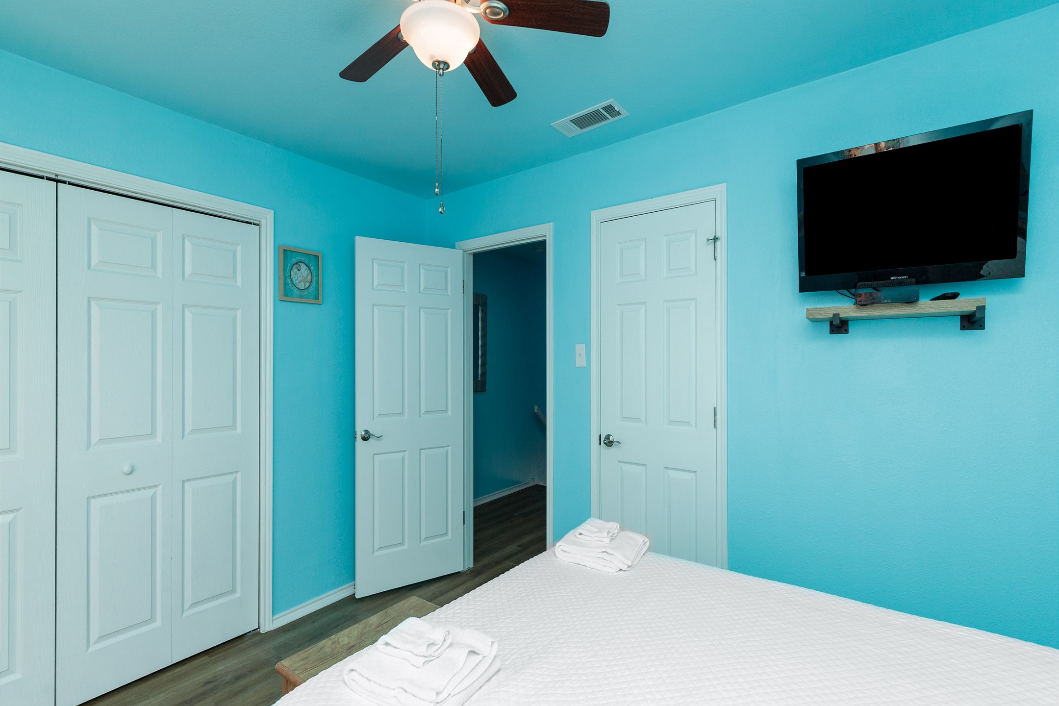 Second bedroom on the second floor with queen size bed, private balcony and flat screen TV