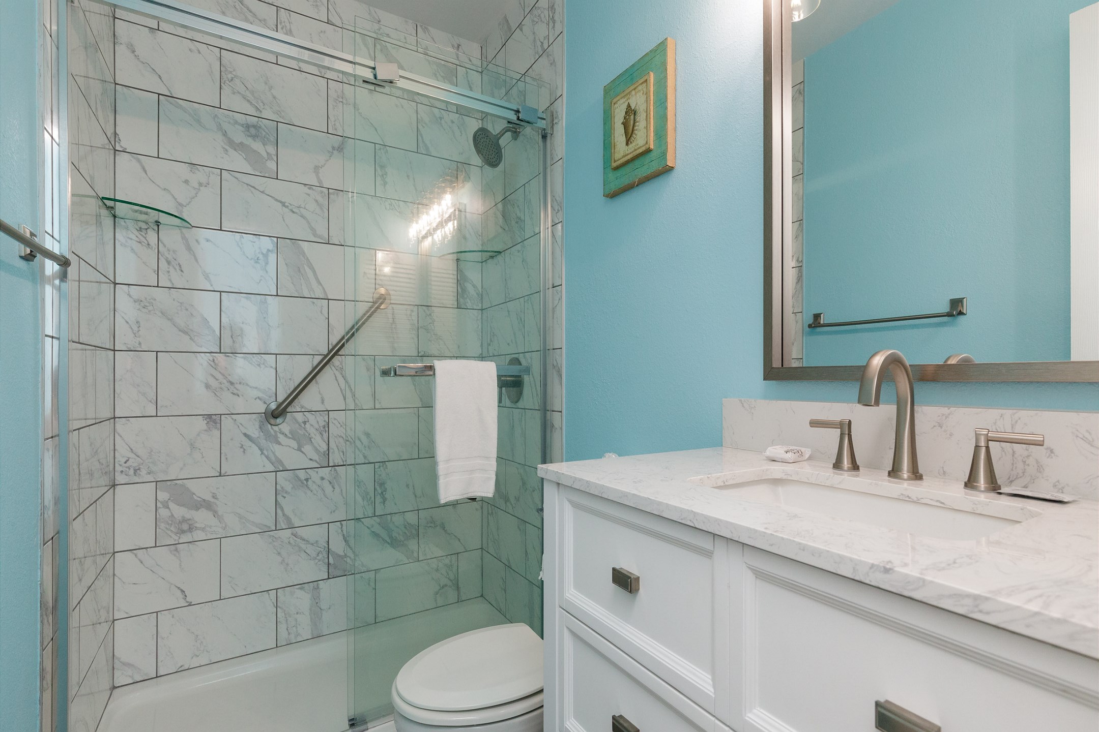 Master bathroom with walk in shower and storage space 