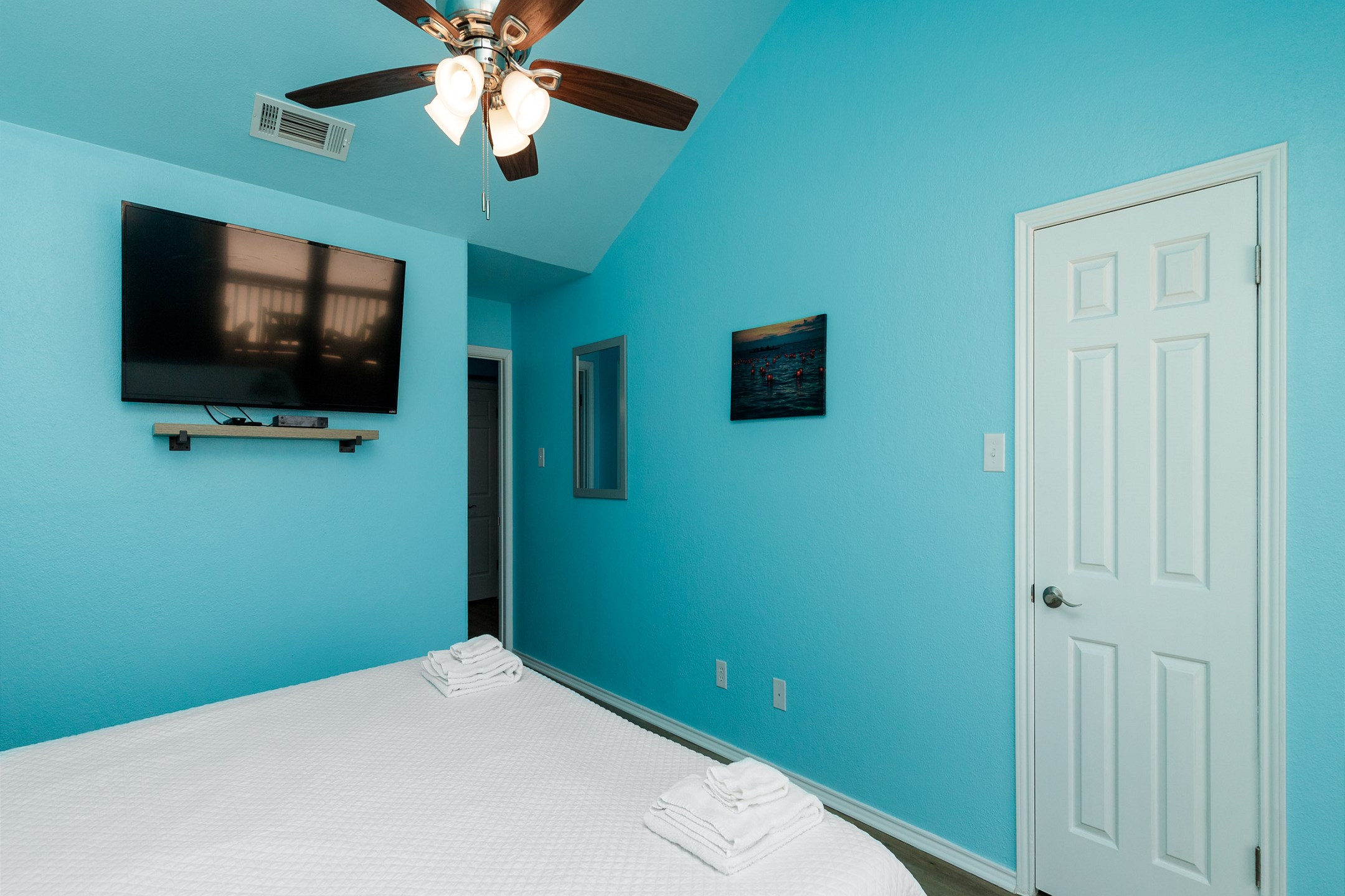 Master bedroom on the second floor with king size bed, ensuite bathroom, private balcony with beachfront views and flat screen TV