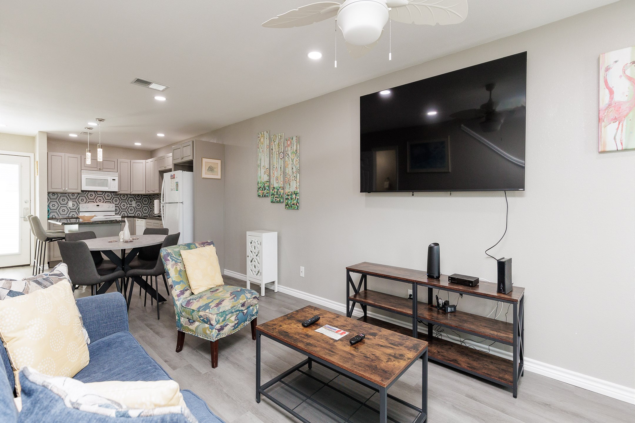 The kitchen, dining, and living areas blend seamlessly for a bright and airy feel