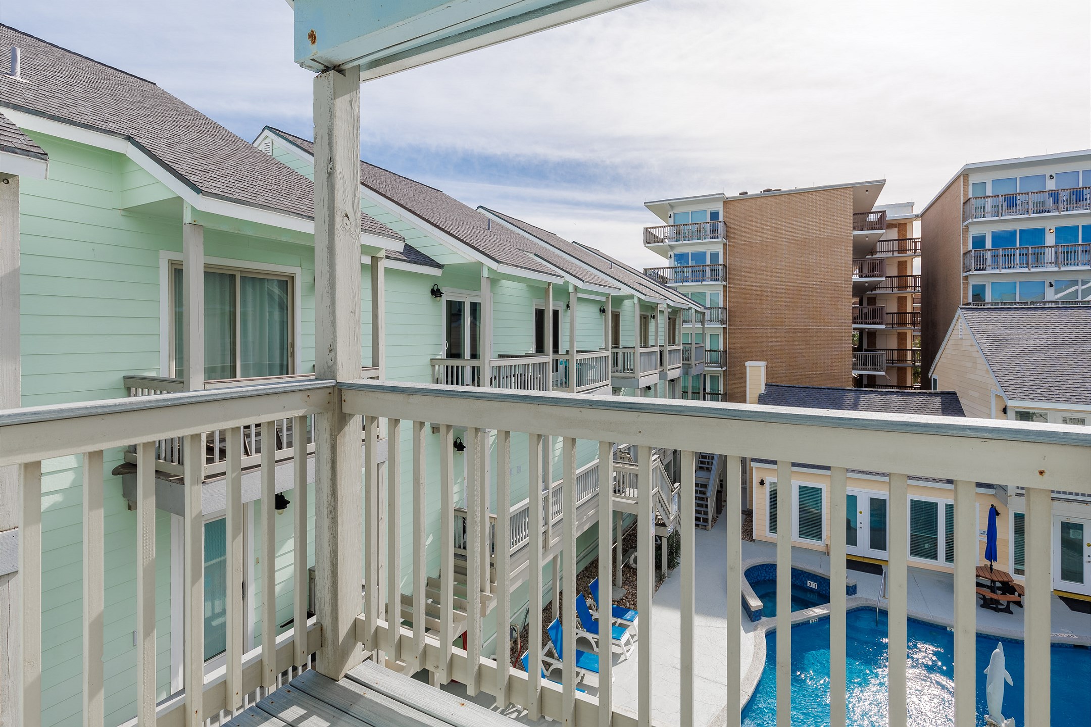 Private balcony off the second bedroom with a view of the pool 