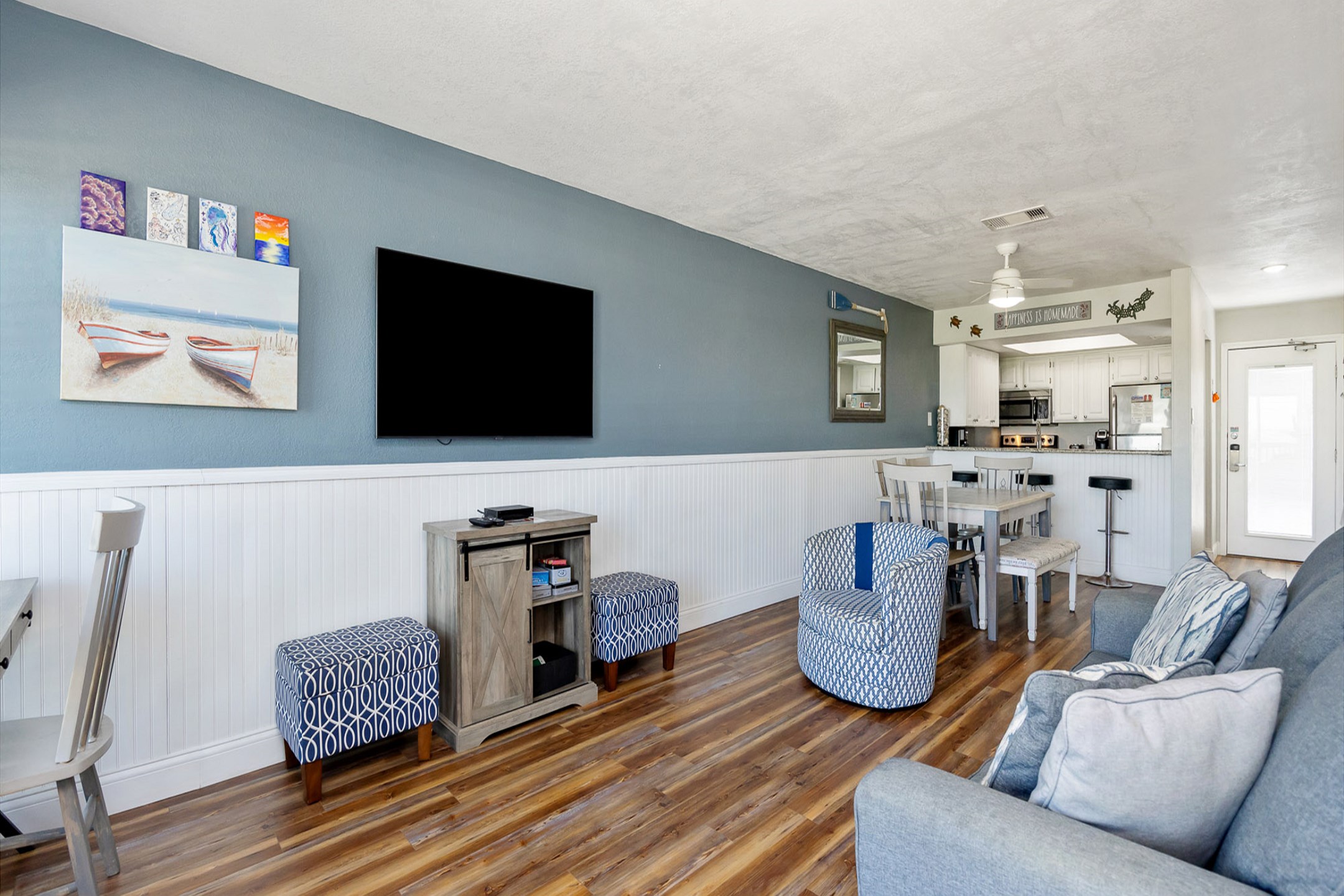 The kitchen, dining, and living areas blend seamlessly for a bright and airy feel