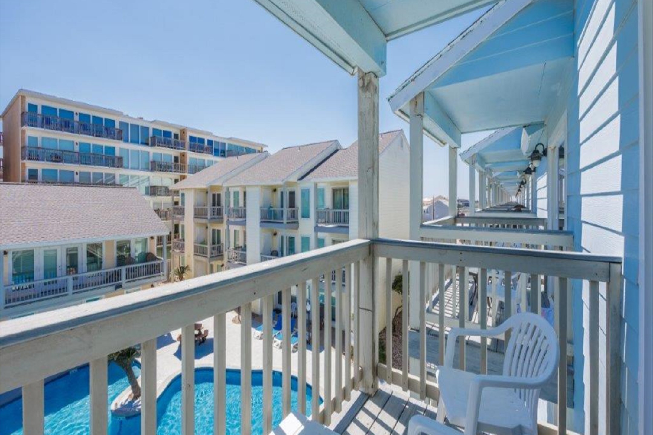 Guest bedroom balcony with a pool view