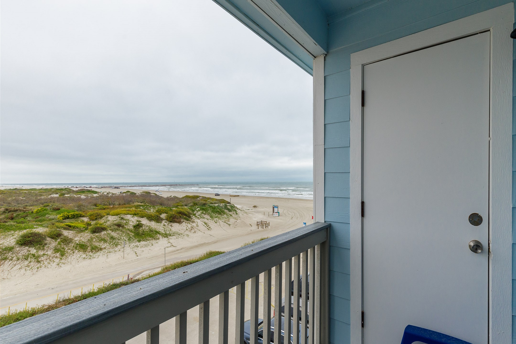 Private balcony off the master bedroom enjoys a view of the dunes as well as the beach