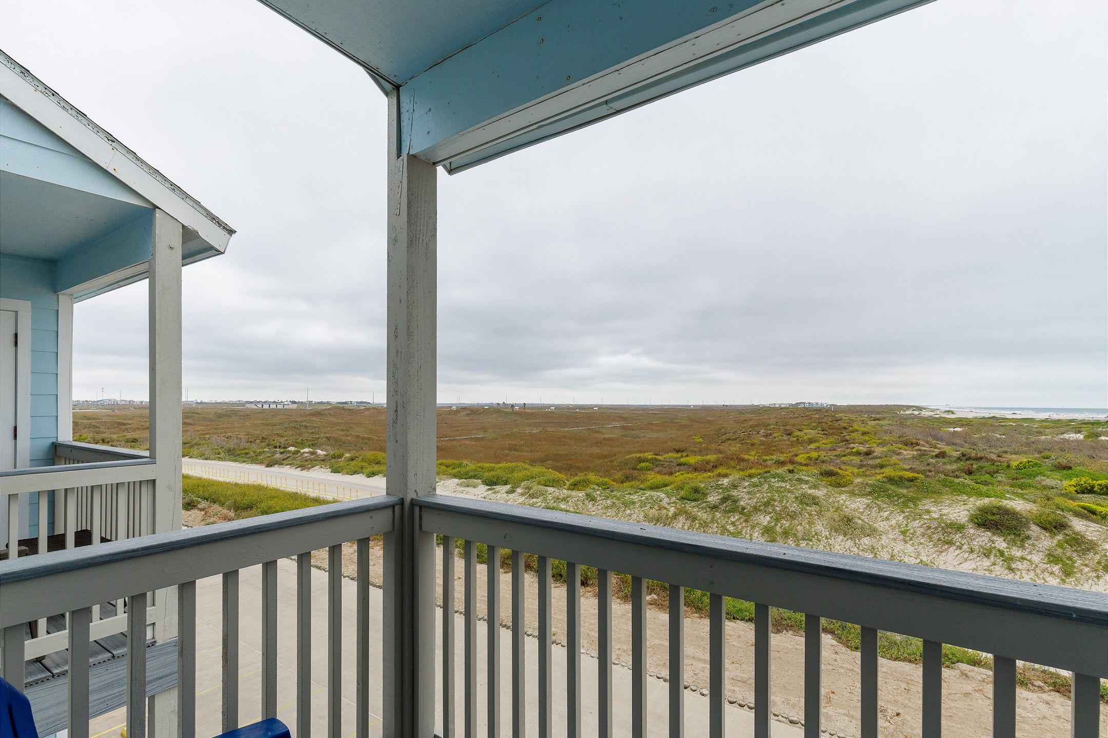 Private balcony off the master bedroom enjoys a view of the dunes as well as the beach