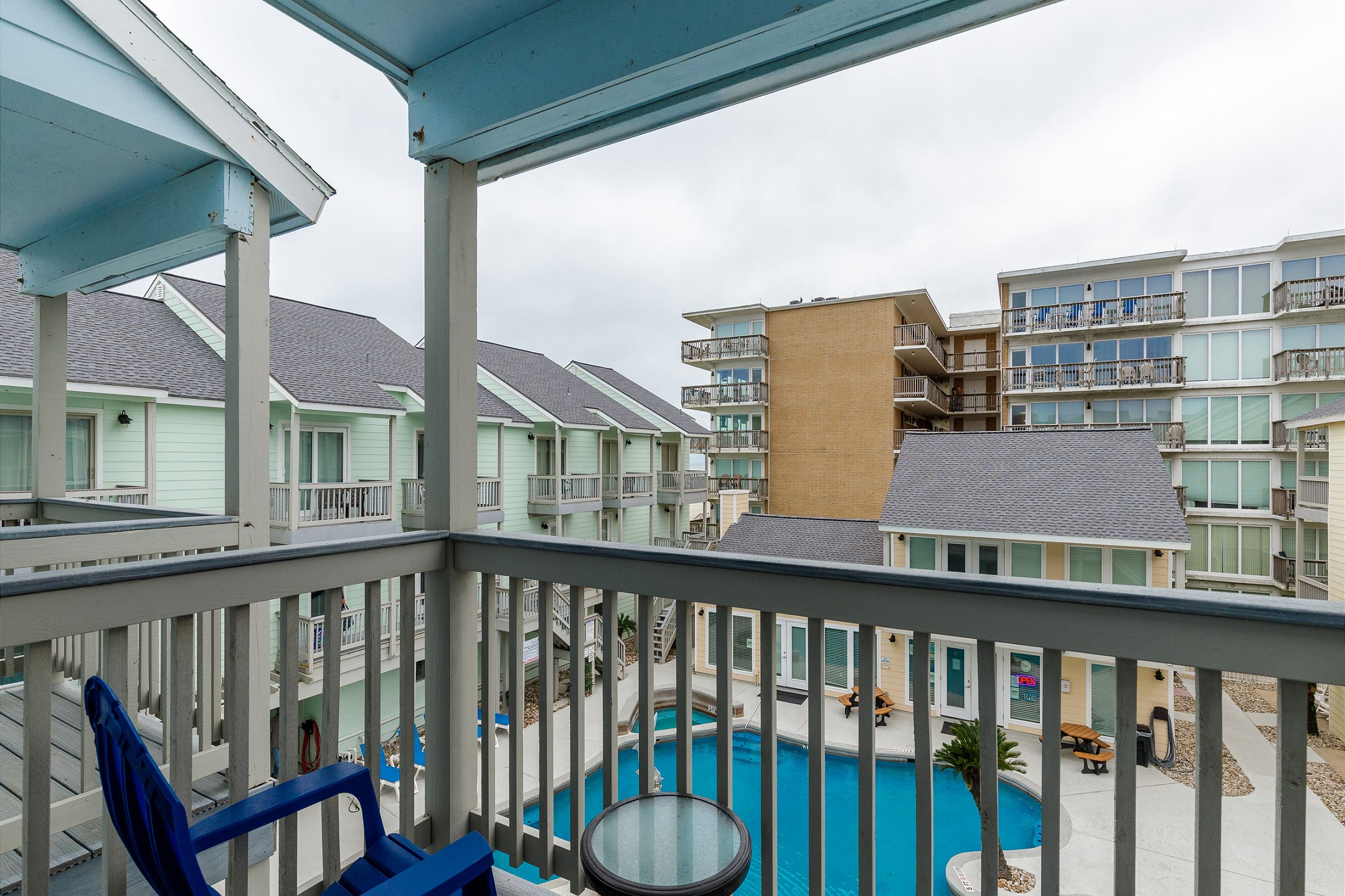 Private balcony off the second bedroom with a view of the pool