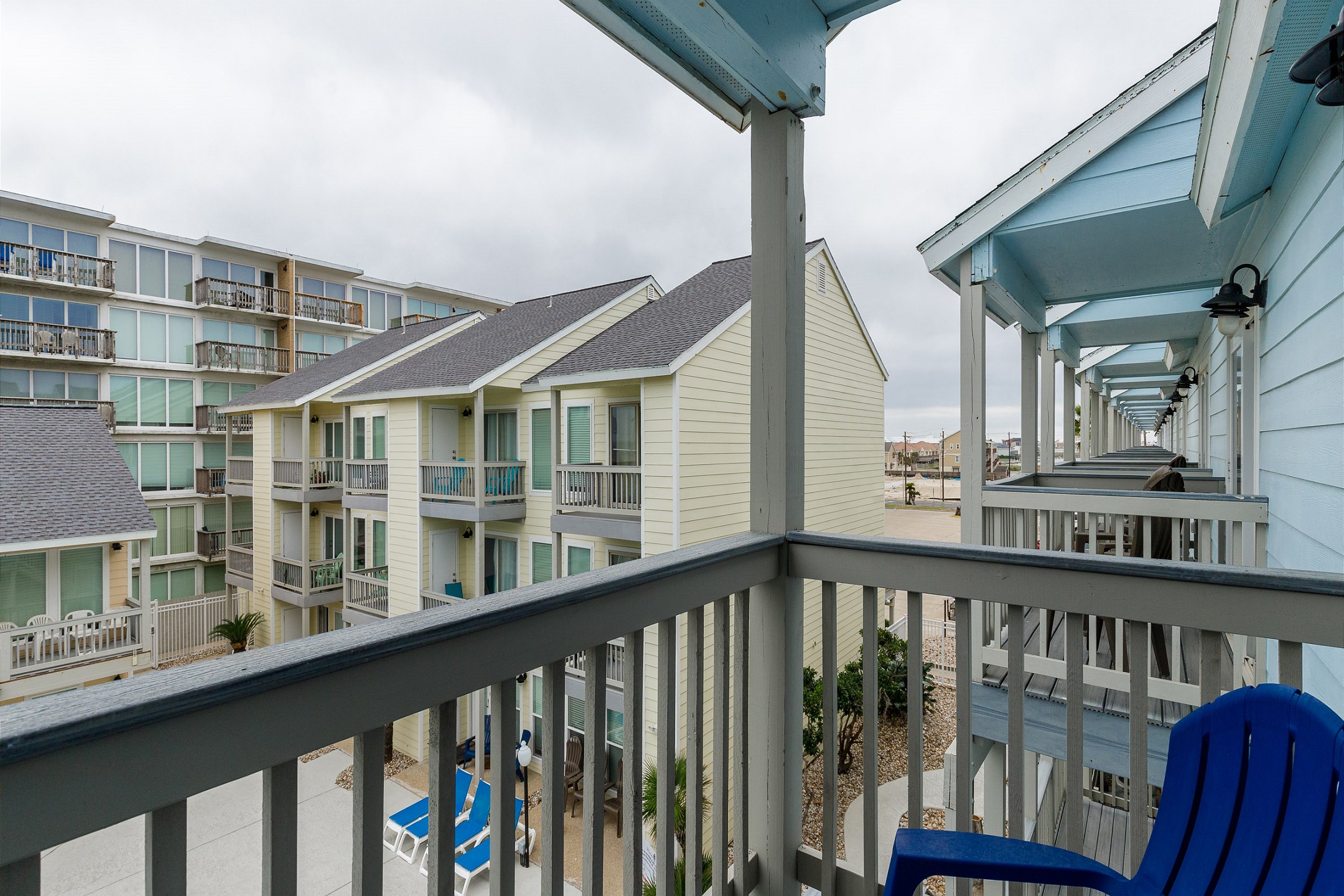Private balcony off the second bedroom with a view of the pool