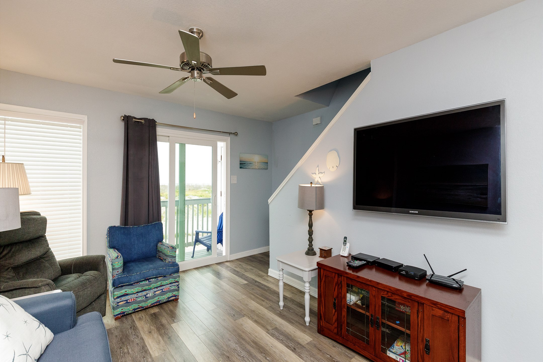 Access to outdoor balcony with a beach view from the living area
