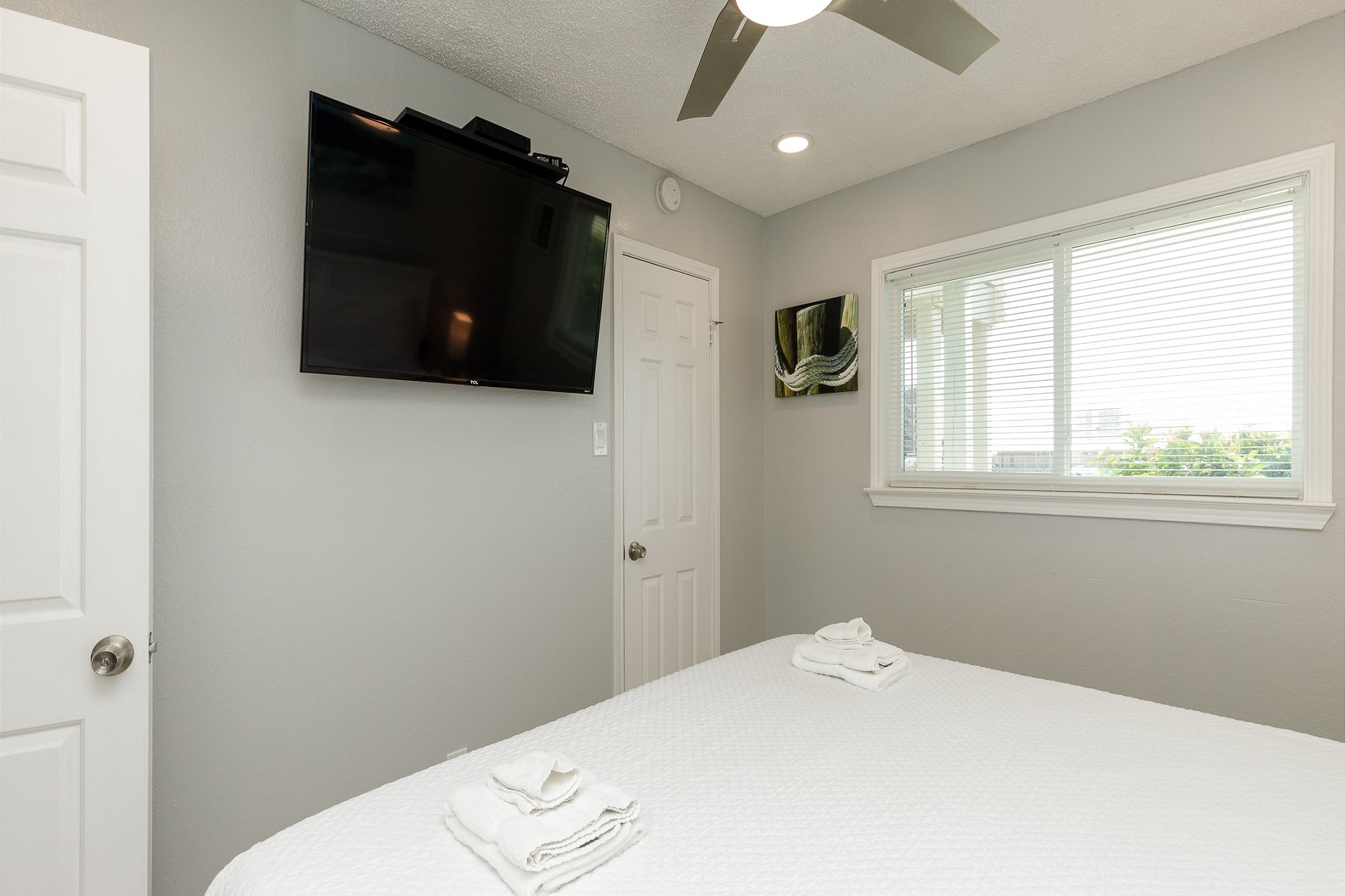 Master bedroom with king size bed and flat screen TV