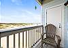 Private balcony off the master bedroom with partial beach views