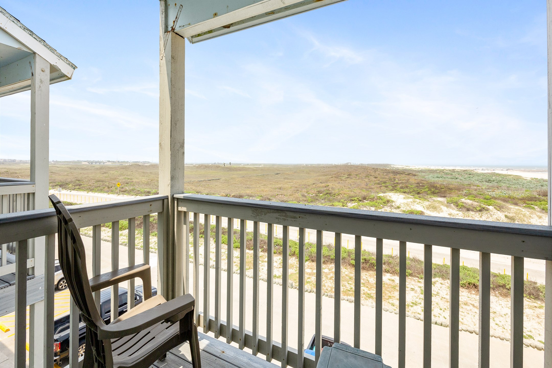 Private balcony off the master bedroom where you can enjoy a view of the beach and the sound of waves crashing on shore
