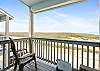 Private balcony off the master bedroom with partial beach views