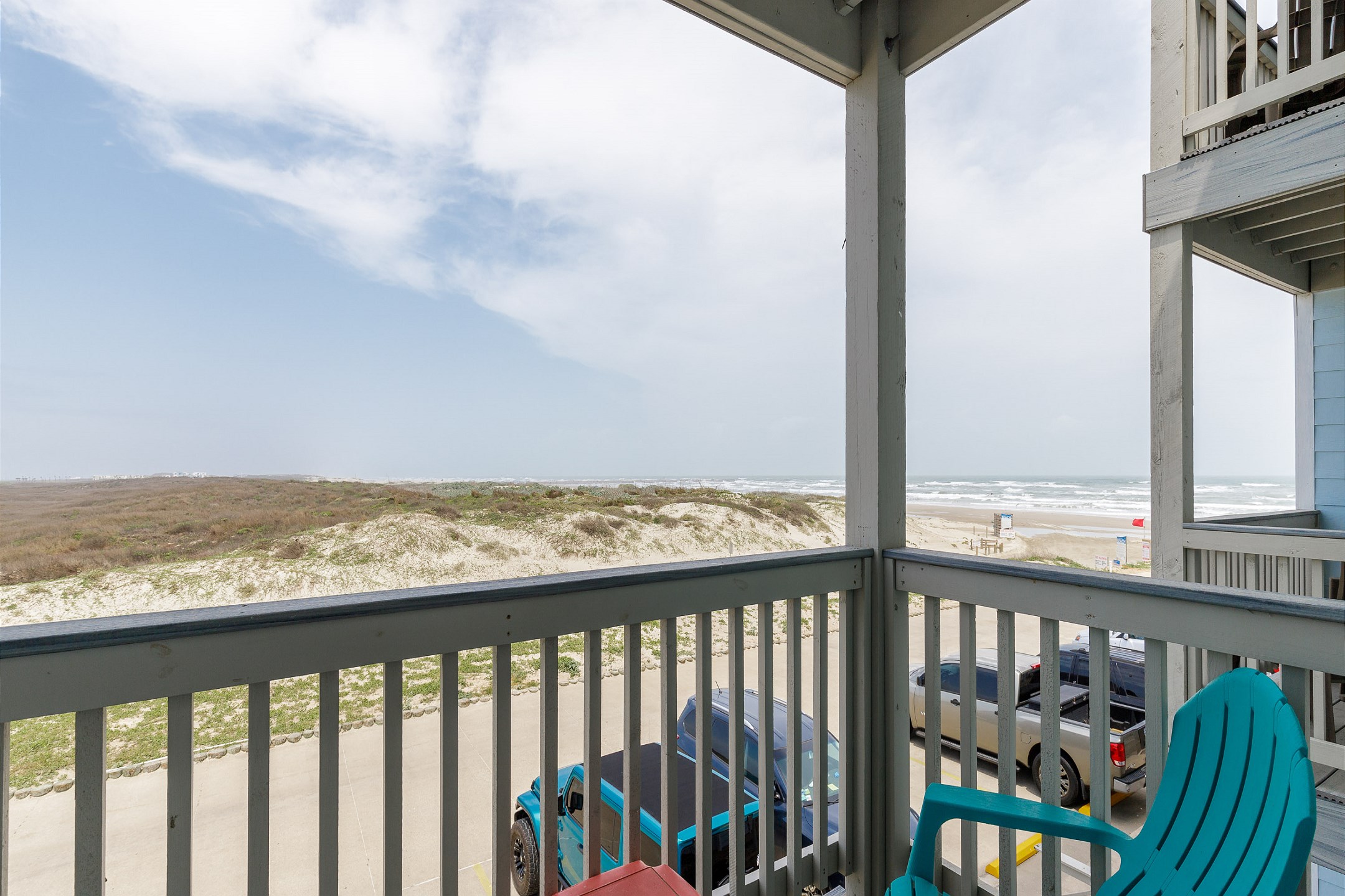 Private balcony off the living area with table and chairs 