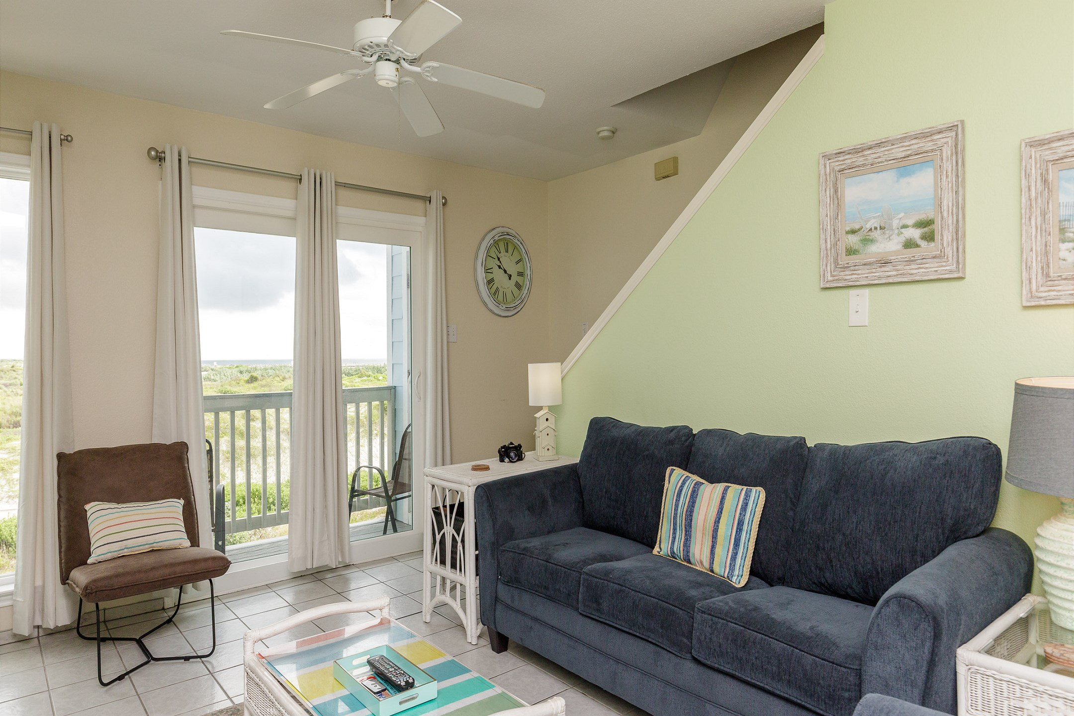 Comfortable living area featuring a queen-size sleeper sofa and beautiful beach view