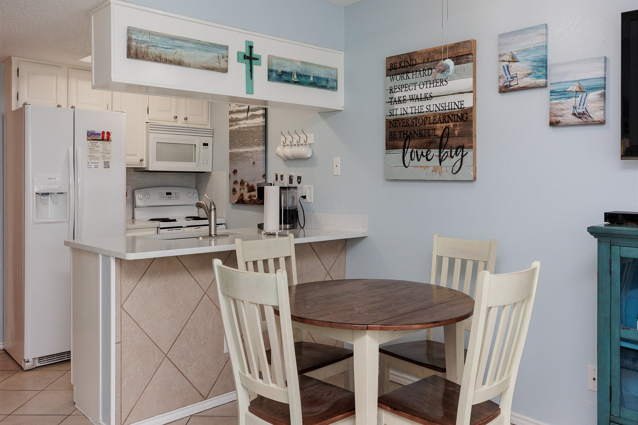 Kitchen and dining area with seating for four 