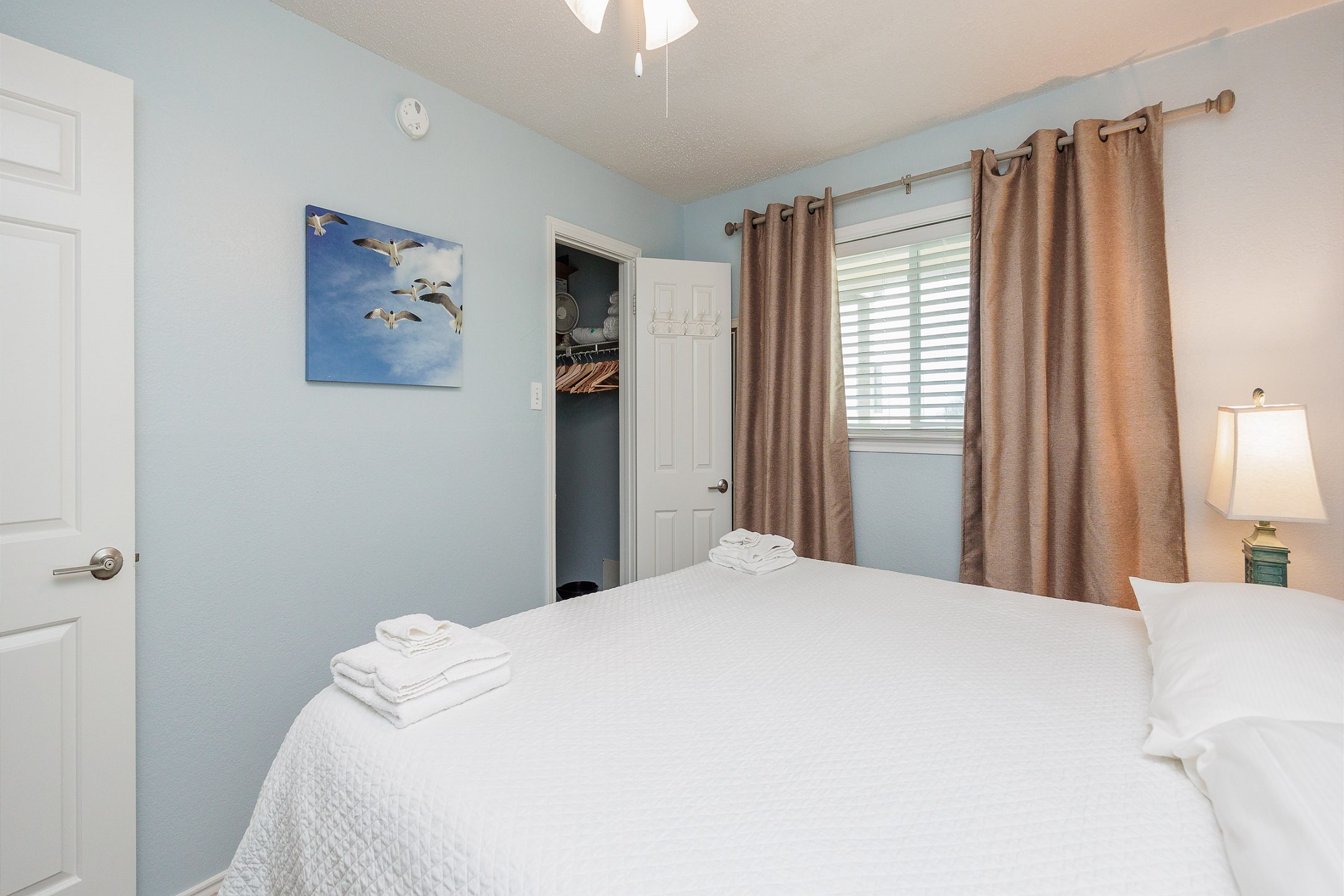 Master bedroom with king size bed and flat screen TV