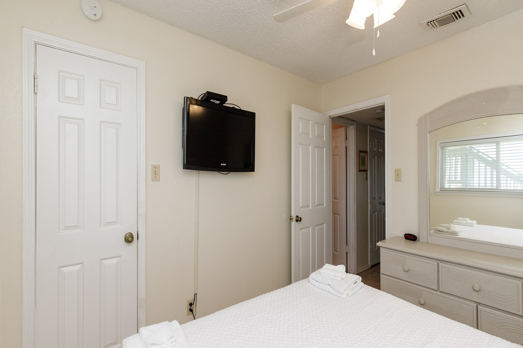 Master bedroom with king size bed and flat screen TV